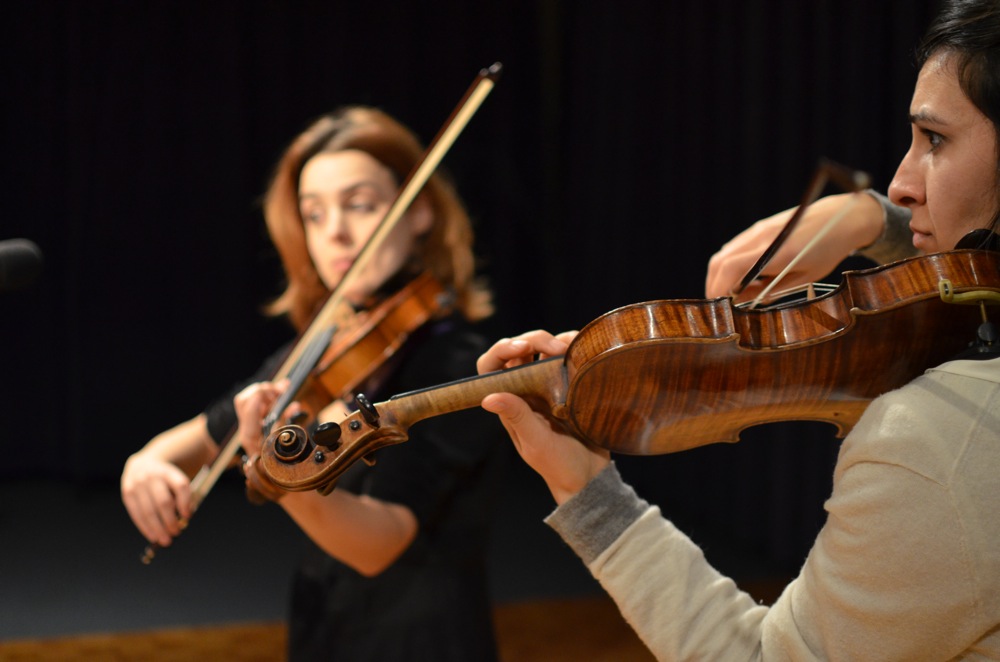 A photo of two female musicians performing in WPR's studios in Madison.