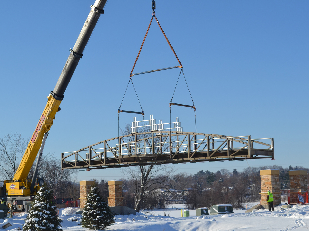 A crane lowering a bridge