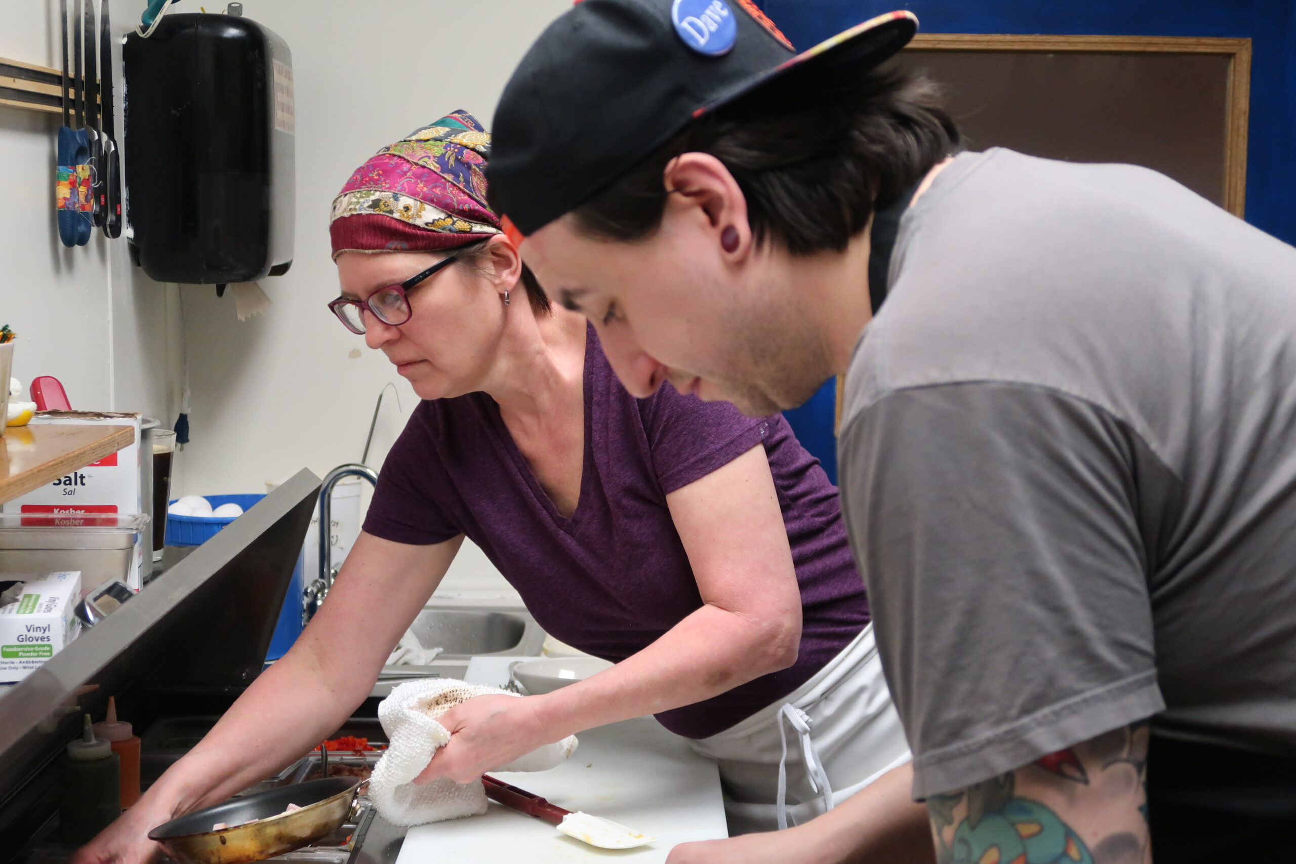 Photo of Noreen Ovadia Wills and a coworker making pastries