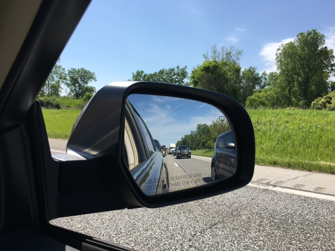 View of traffic on I-94 in side mirror