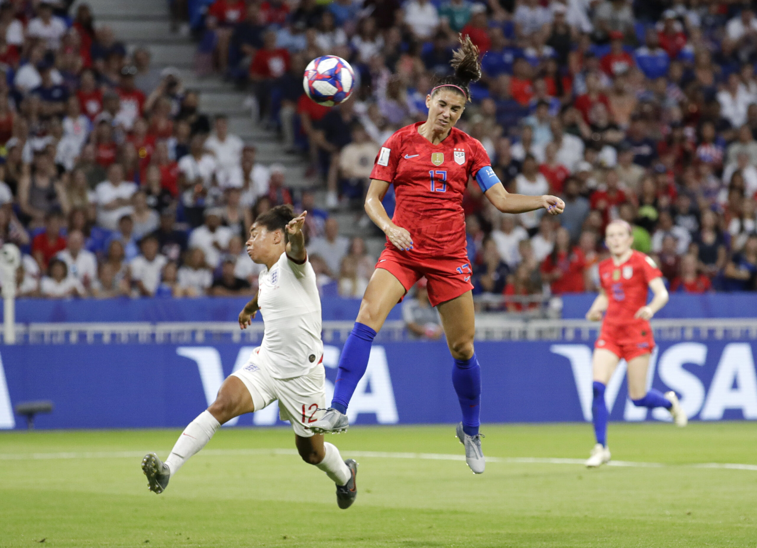 United States' Alex Morgan, right, scores her side's second goal, during the Women's World Cup semifinal soccer match between England and the United States on July 2, 2019..