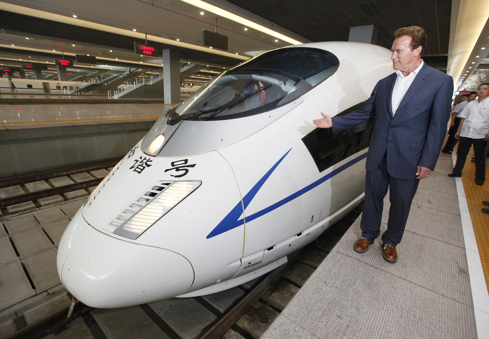 California Gov. Arnold Schwarzenegger inspects a China's high-speed train