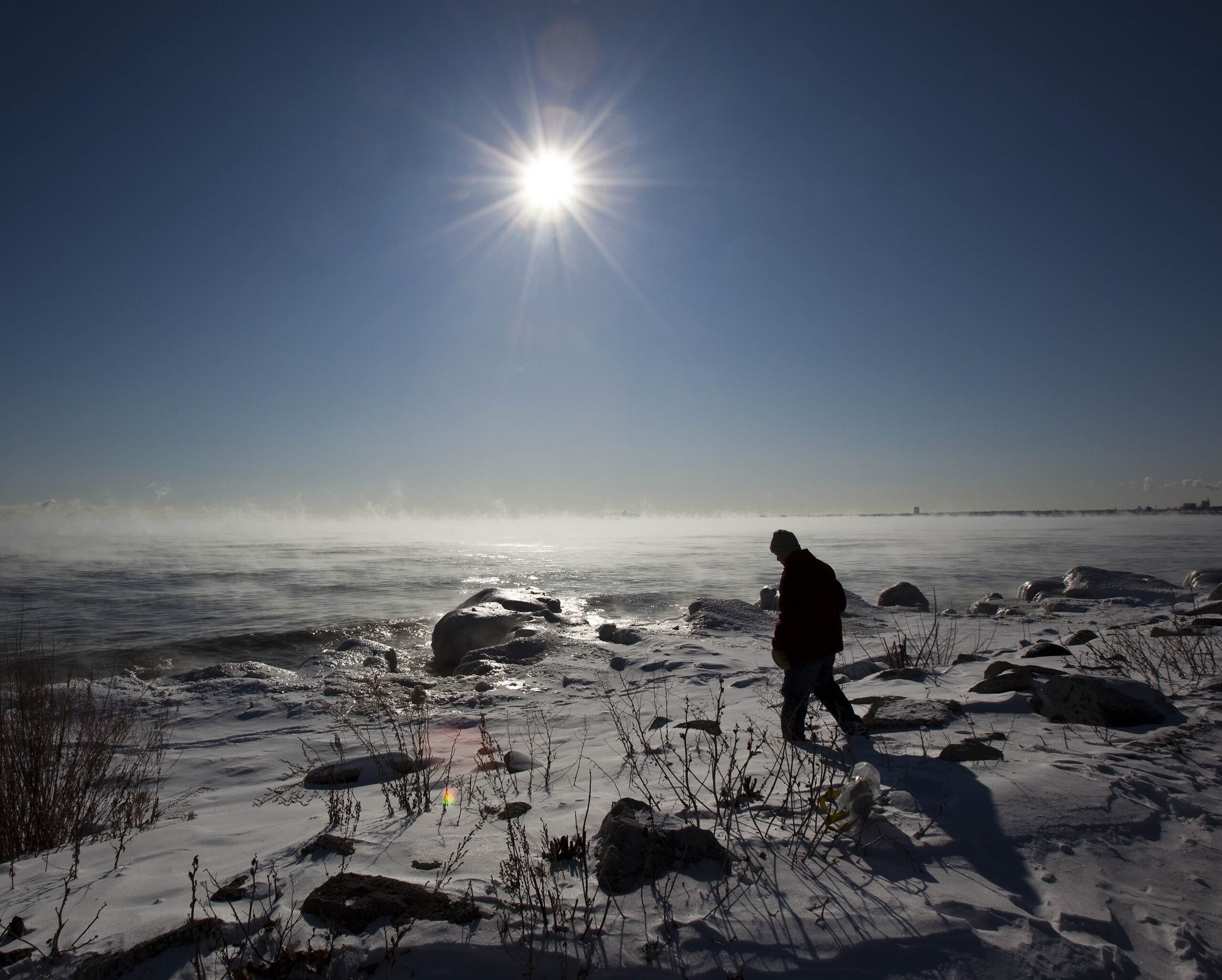 Man walking along Lake Superior