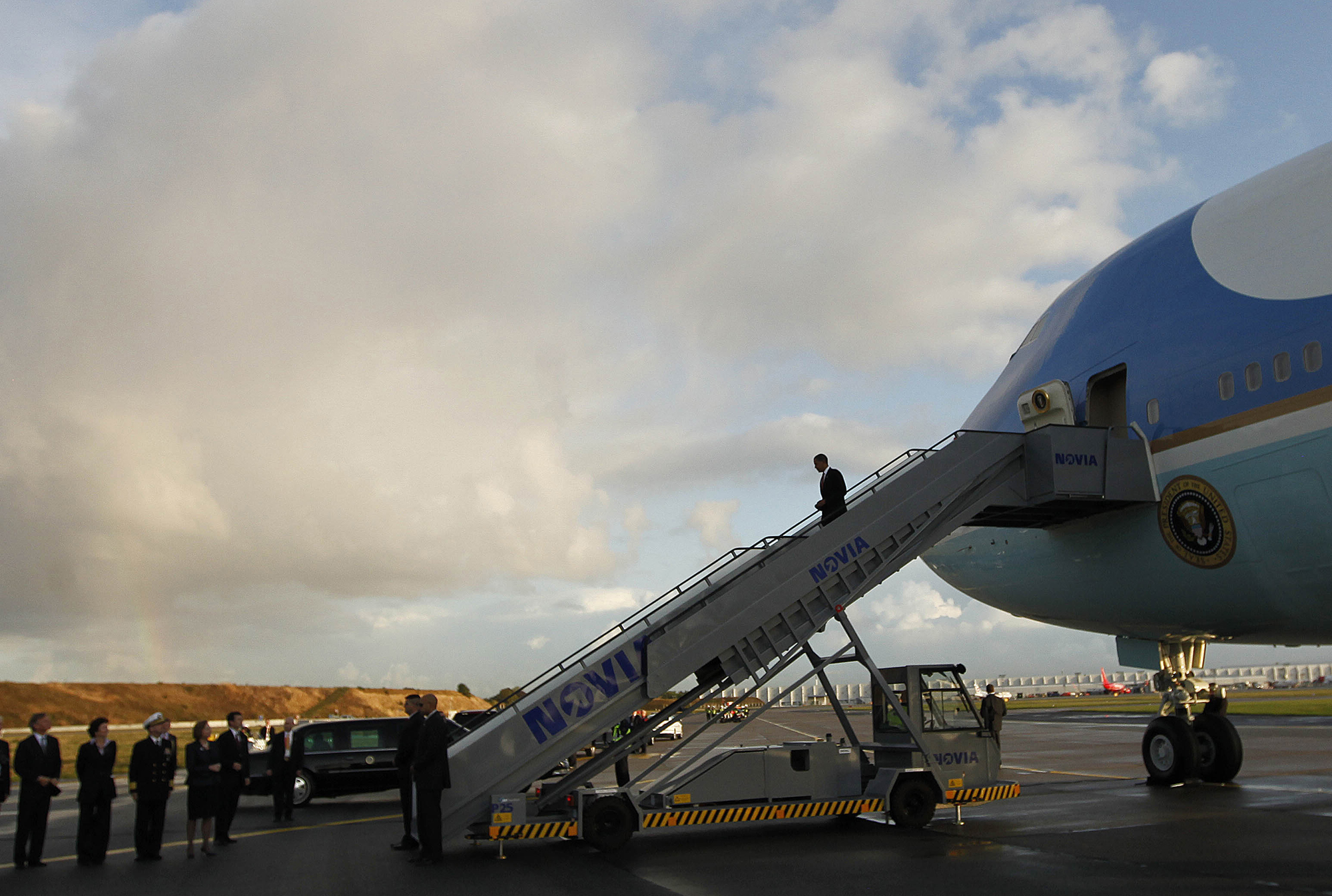 U.S. President Barack Obama walks down the steps of Air Force One