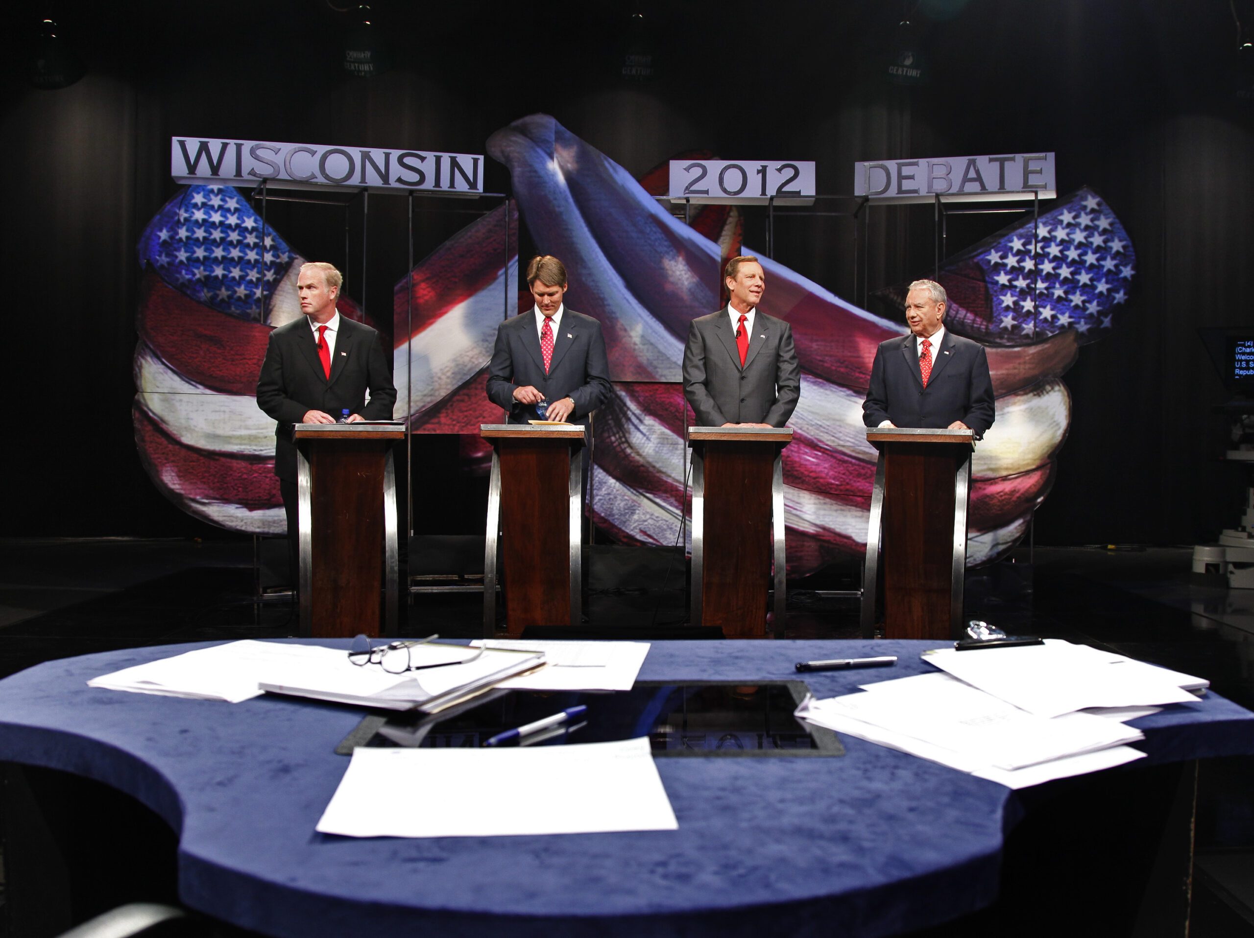 Republican candidates prepare before their debate Friday, Aug. 10, 2012