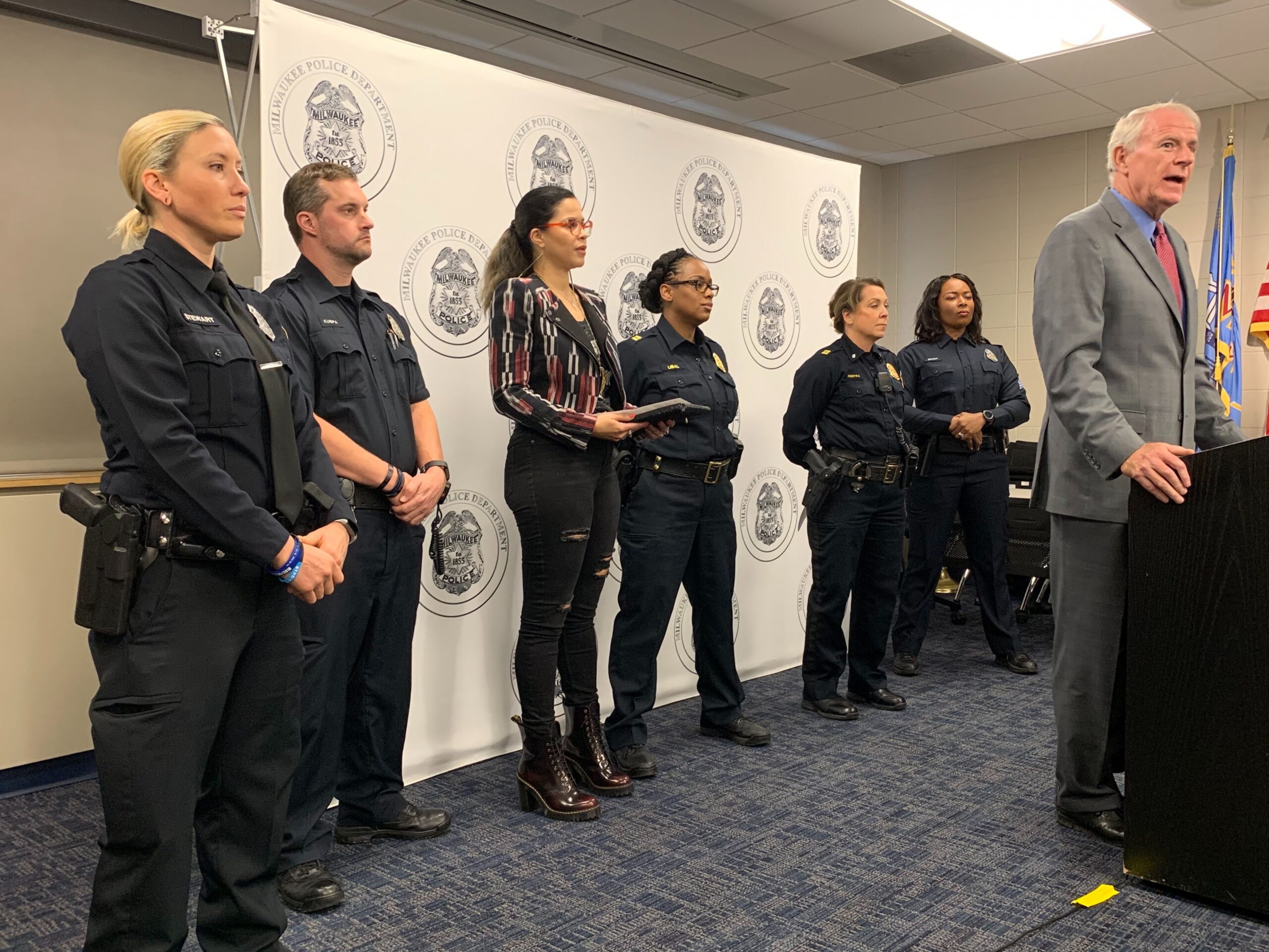 Milwaukee Mayor Tom Barrett and several Milwaukee police officers