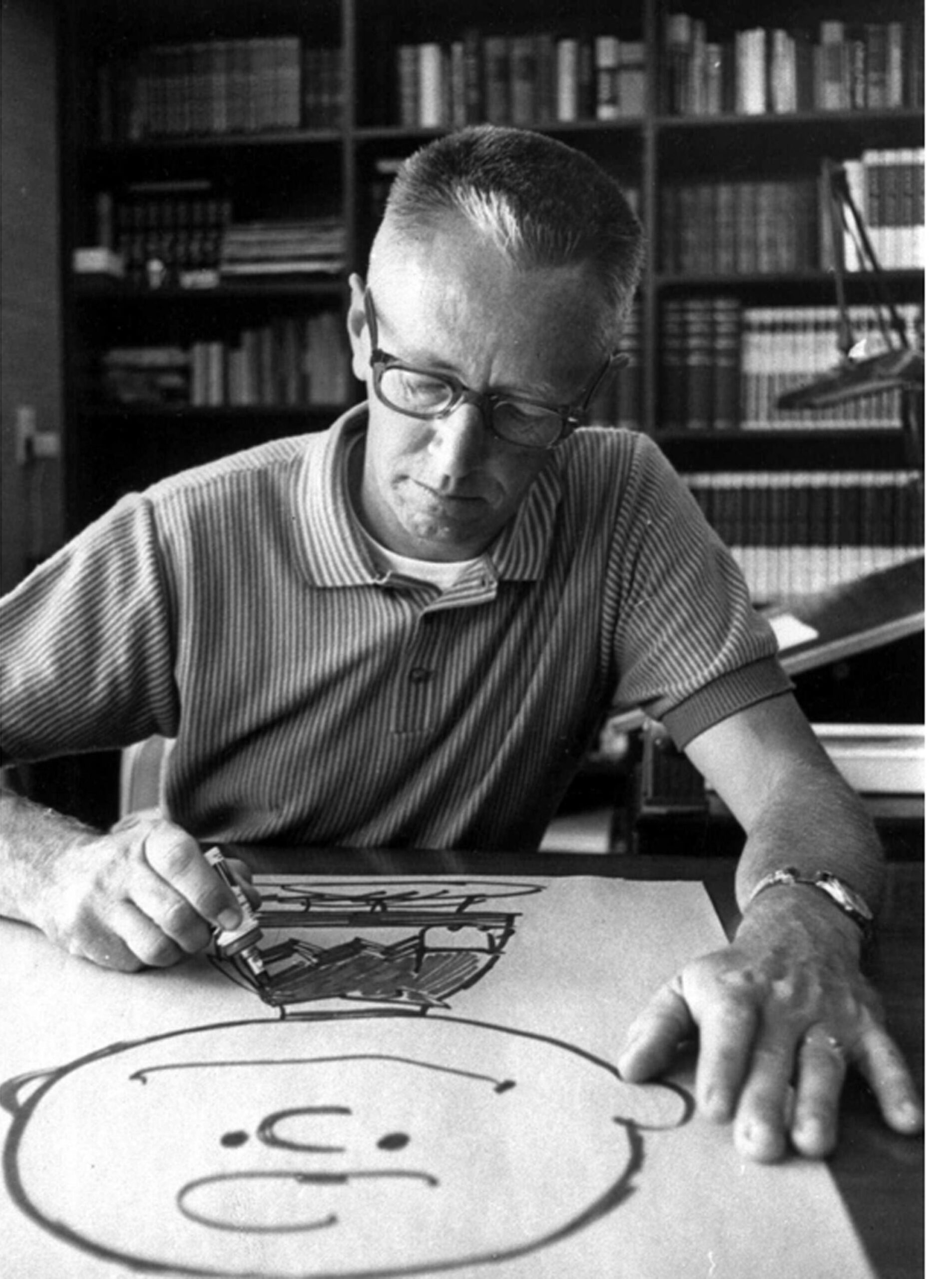 Cartoonist Charles Schulz draws a picture of his cartoon character Charlie Brown in his Sebastopol, Calif. home in this 1966 file photo