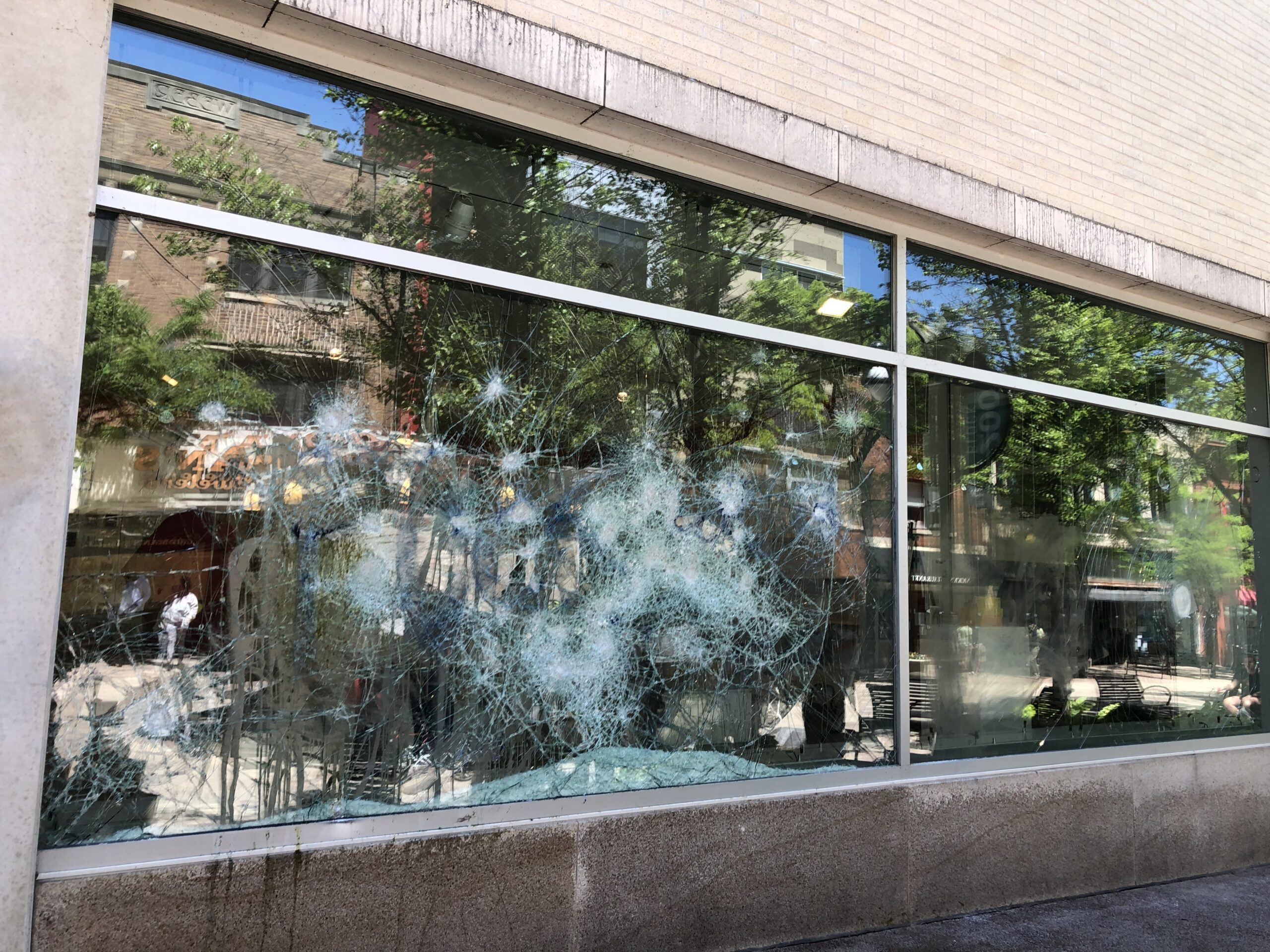 a smashed window on State Street in Madison