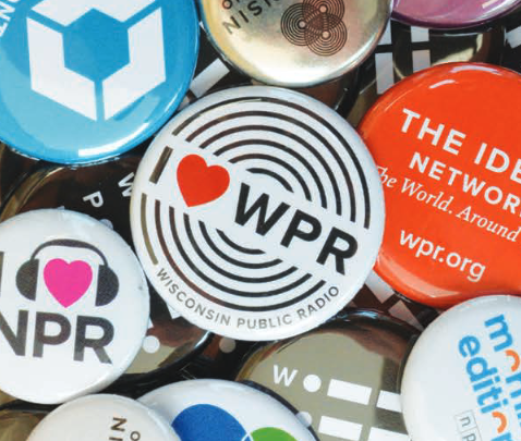 buttons and pins that say WPR scattered across a table