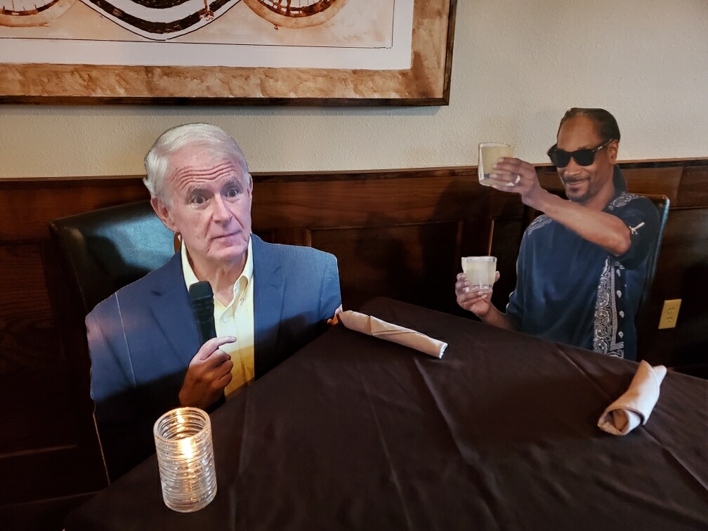 Cardboard cutouts of well-known figures are used to ensure spacing between patrons at Milwaukee Steakhouse.