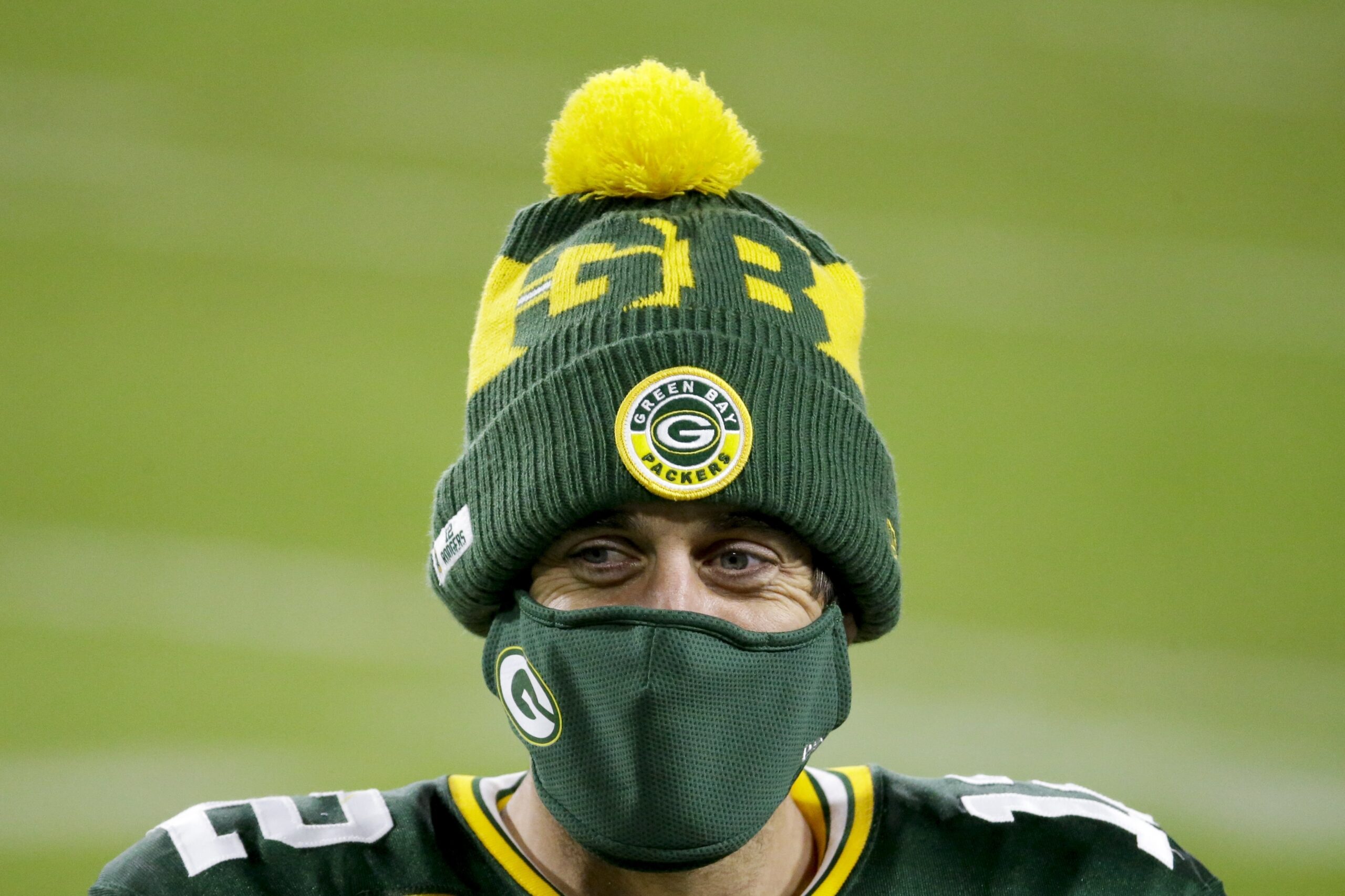 Green Bay Packers' Aaron Rodgers wears a mask after an NFL football game