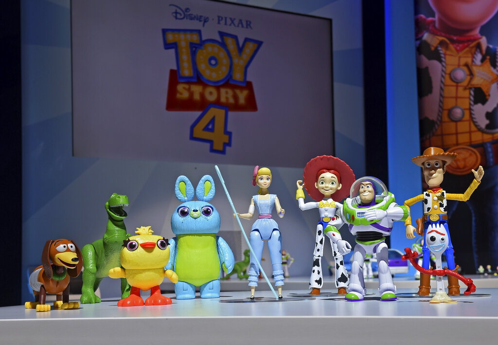 The animated characters of Toy Story 4 stand in a line.