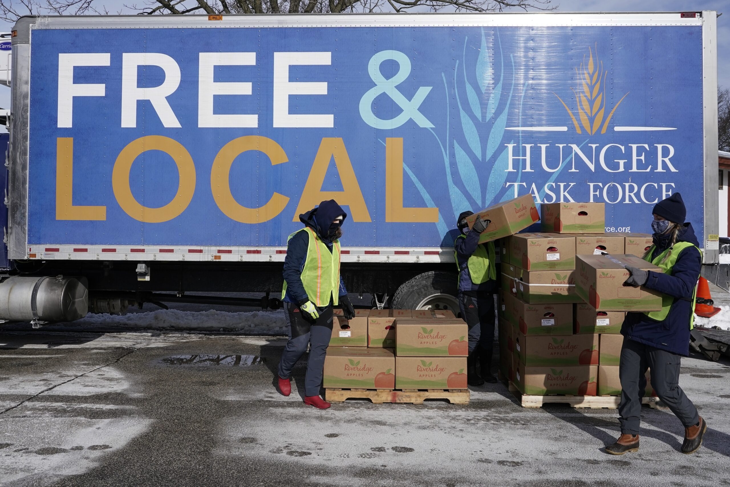 Hunger Task Force Workers distribute food at McGovern Park in Milwaukee