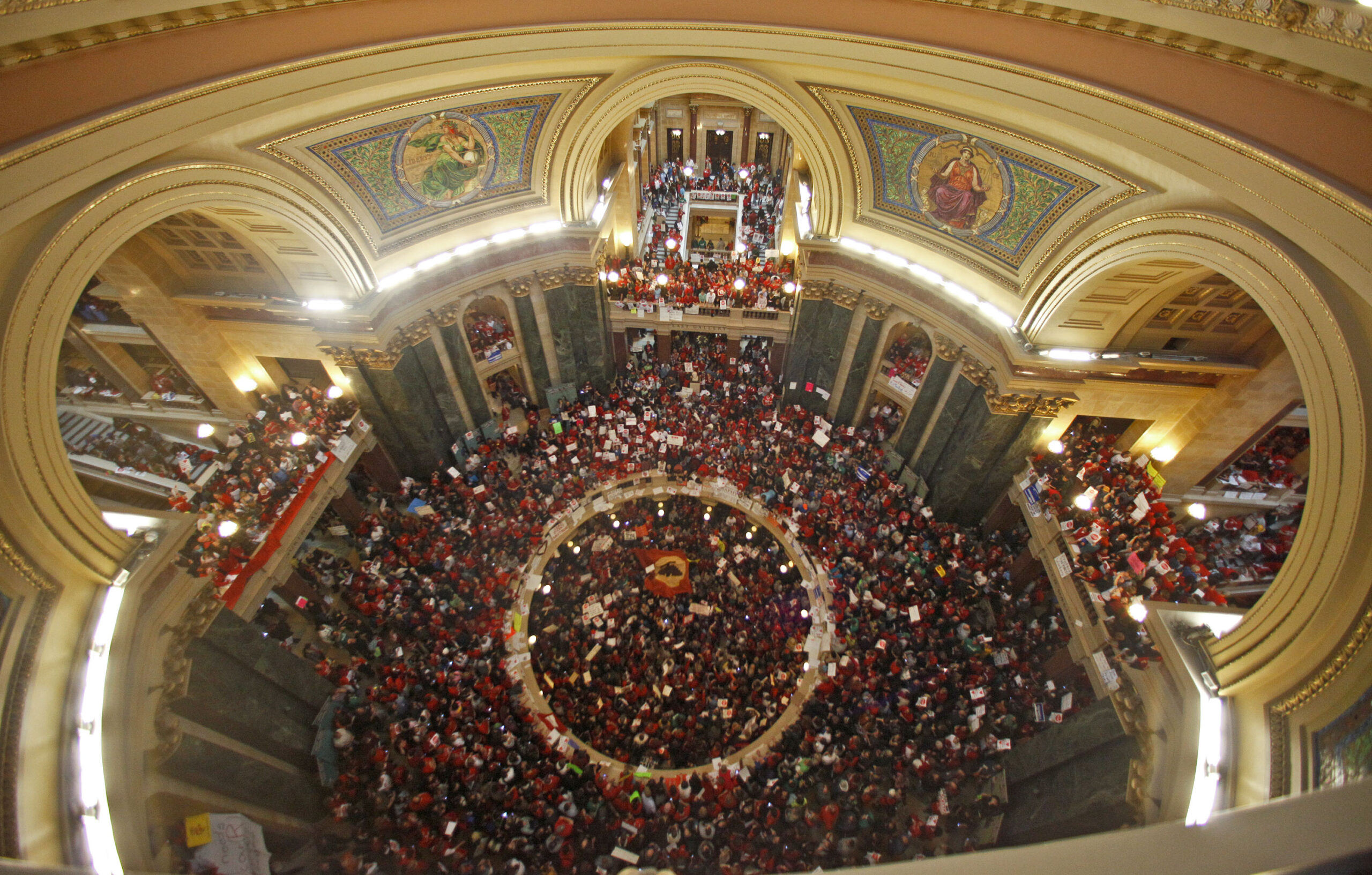 protestors pack the rotunda at the state Capitol in Madison