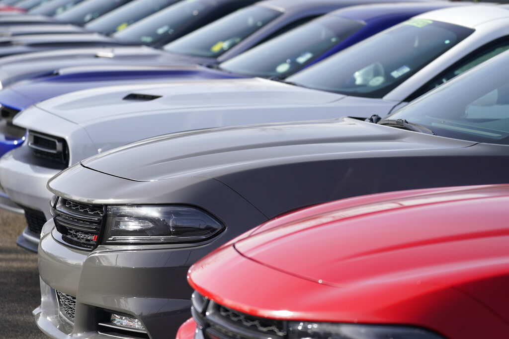 A long row of used Dodge models at a Dodge dealership