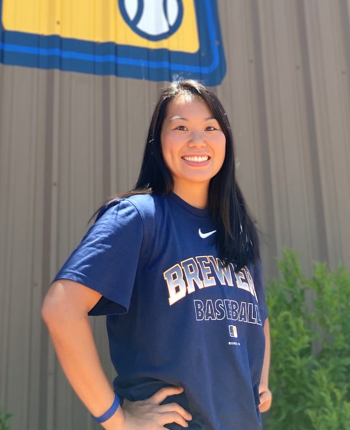 Theresa Lau poses for a photo in Brewers gear