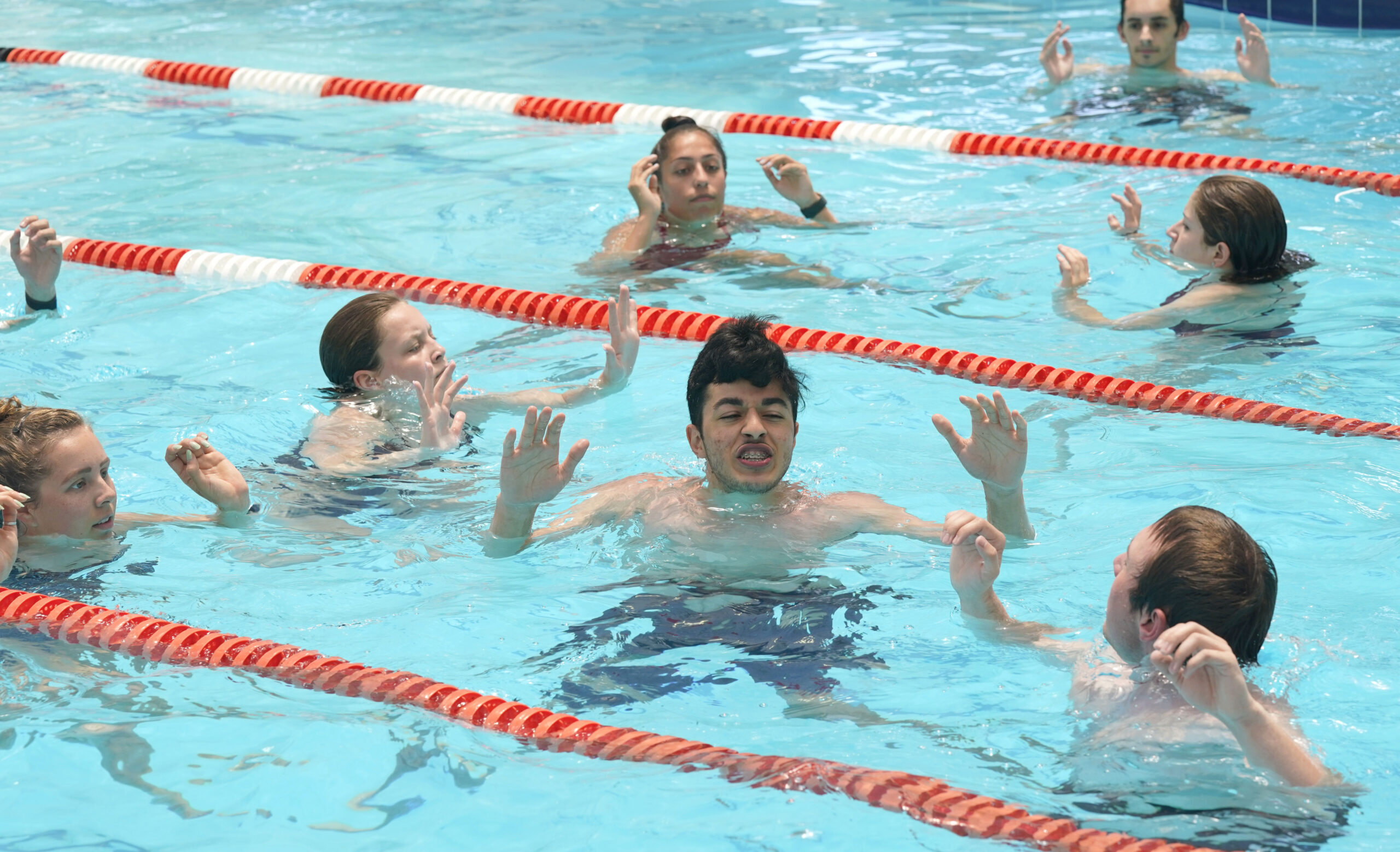 Lifeguards tread water without their hands during a training drill