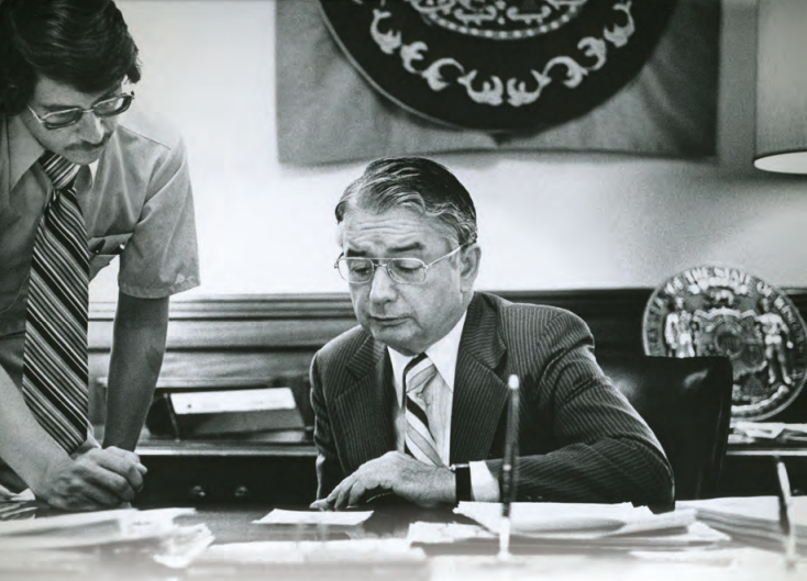 Gov. Patrick Lucey consults with his executive secretary Joe Sensenbrenner in 1977. From the cover of "Patrick J. Lucey: A Lasting Legacy"