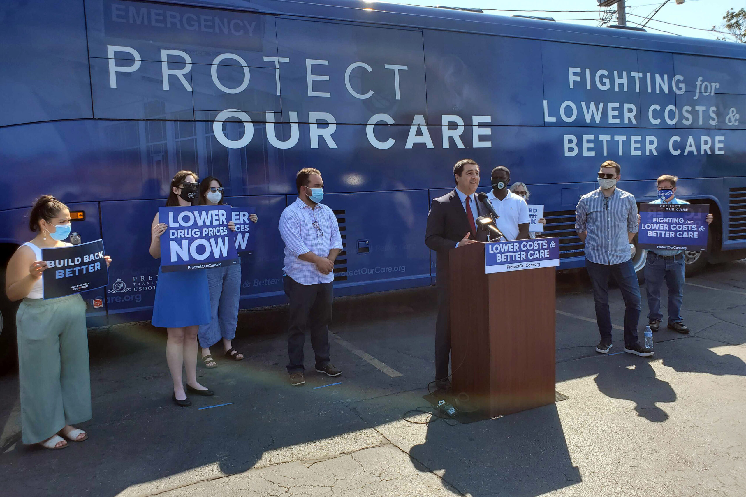 Josh Kaul speaks at an event calling for lower health care costs
