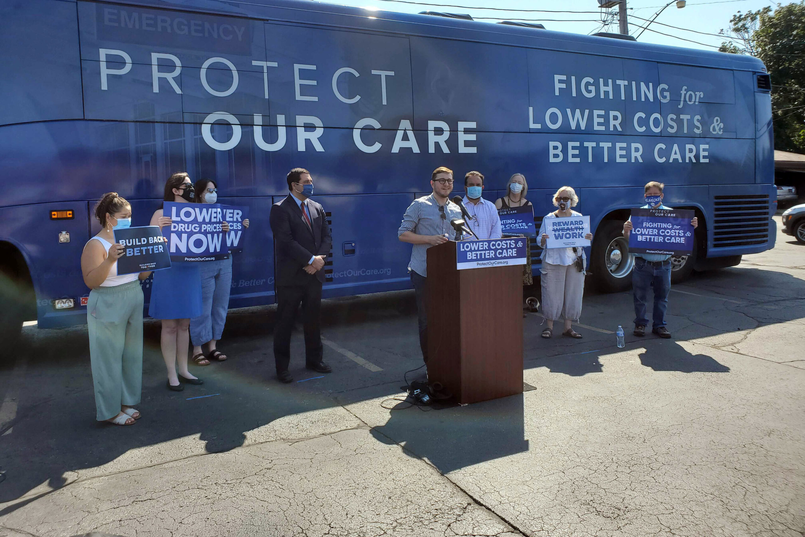 Dustin Klein speaks at an event calling for lower health care costs