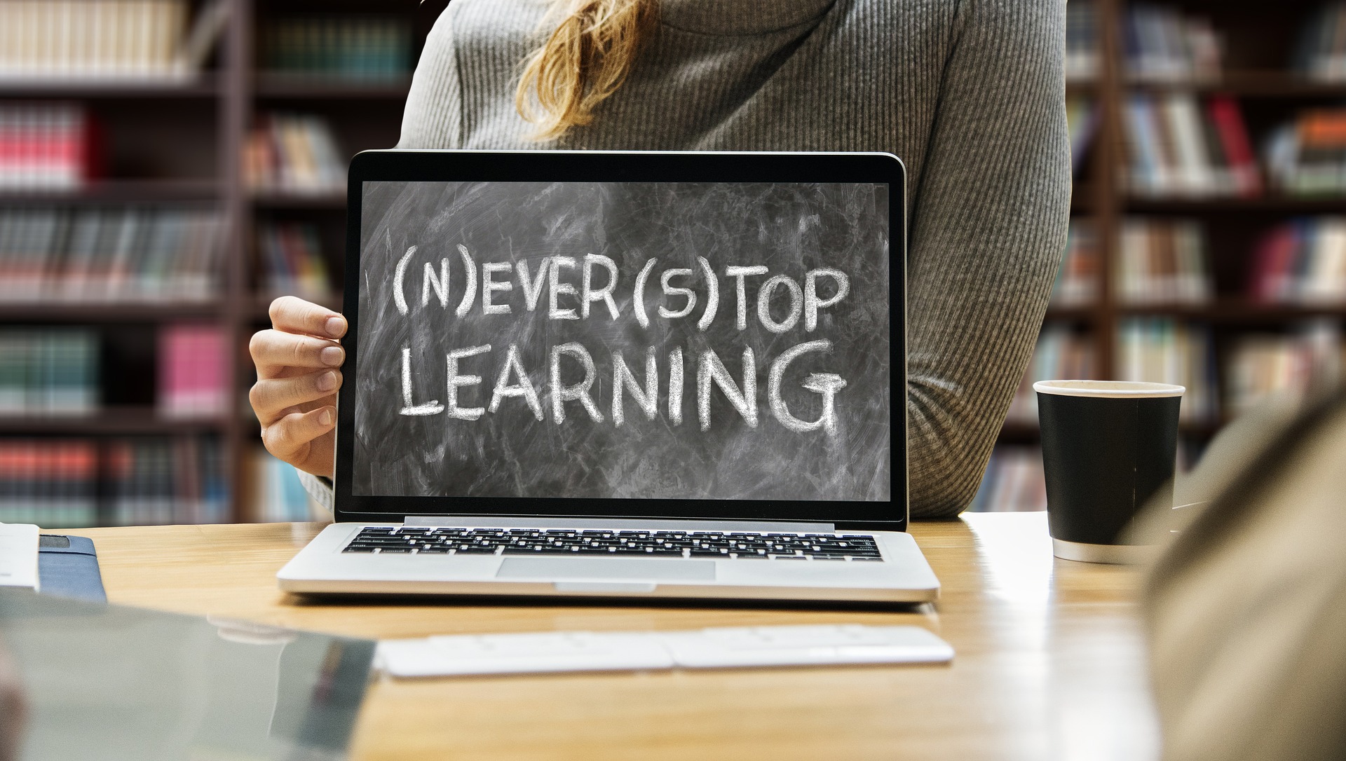 Lap top screen that says 'never stop learning.'