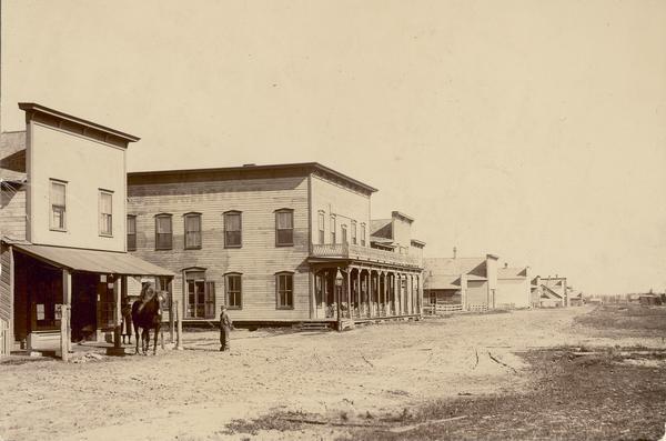 Boy and horse in front of Boyceville post office