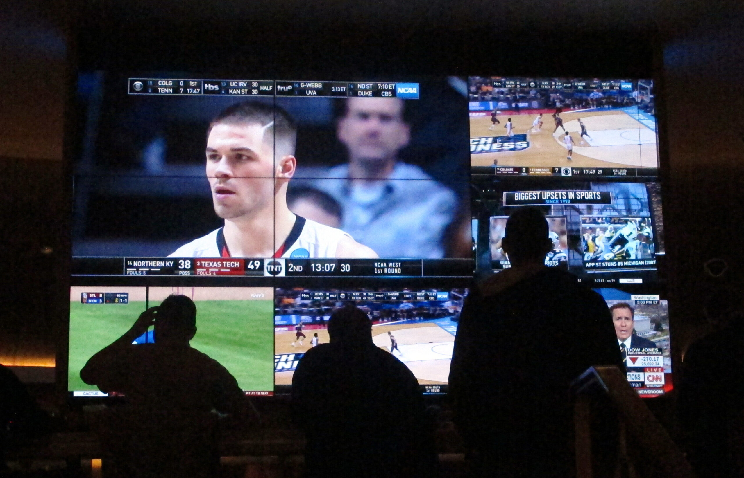 customers watch a game during the NCAA March Madness college basketball tournament