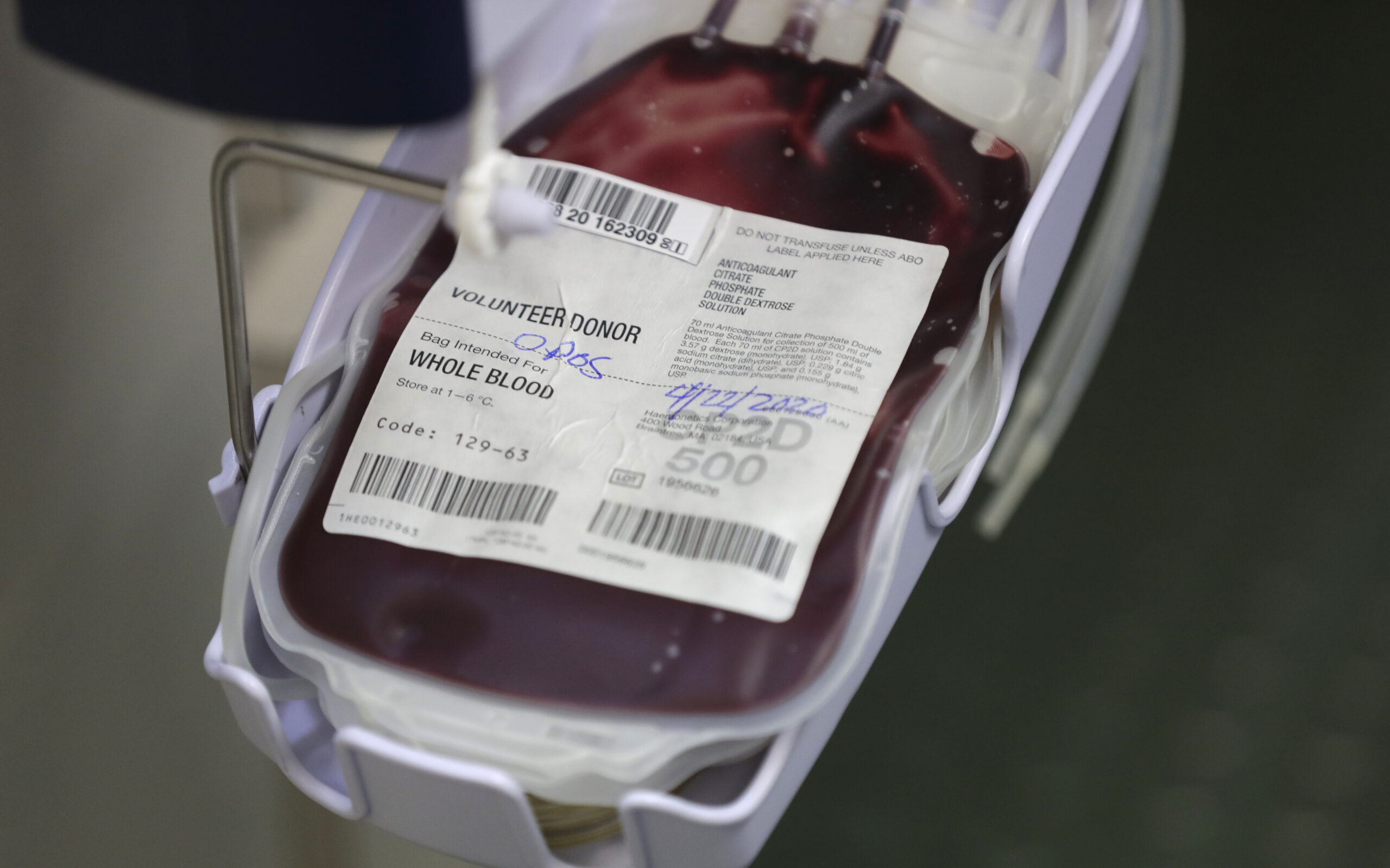 Donated blood fills into a collection bag aboard a OneBlood blood donation bus