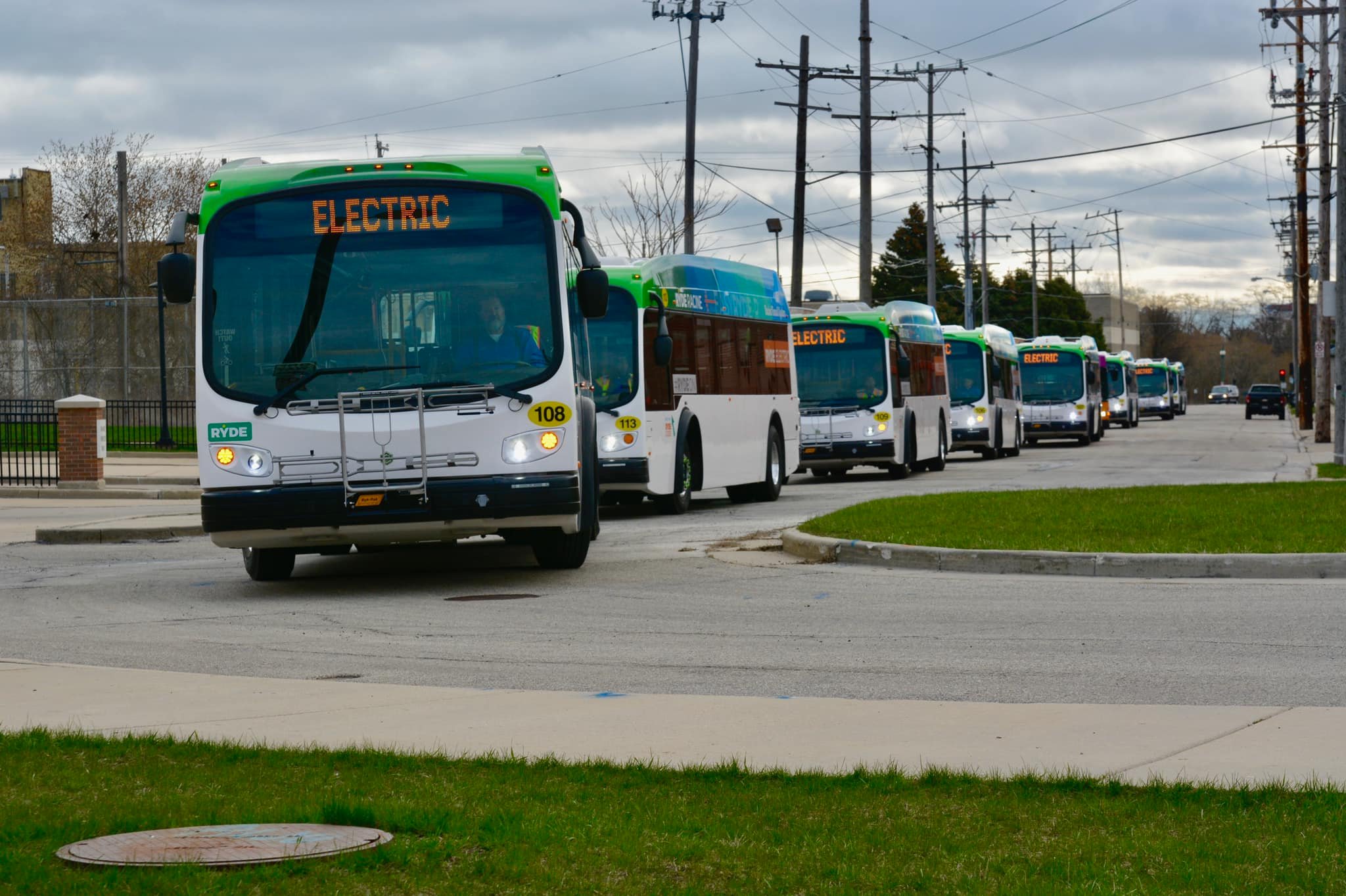 Buses driving down a Racine street