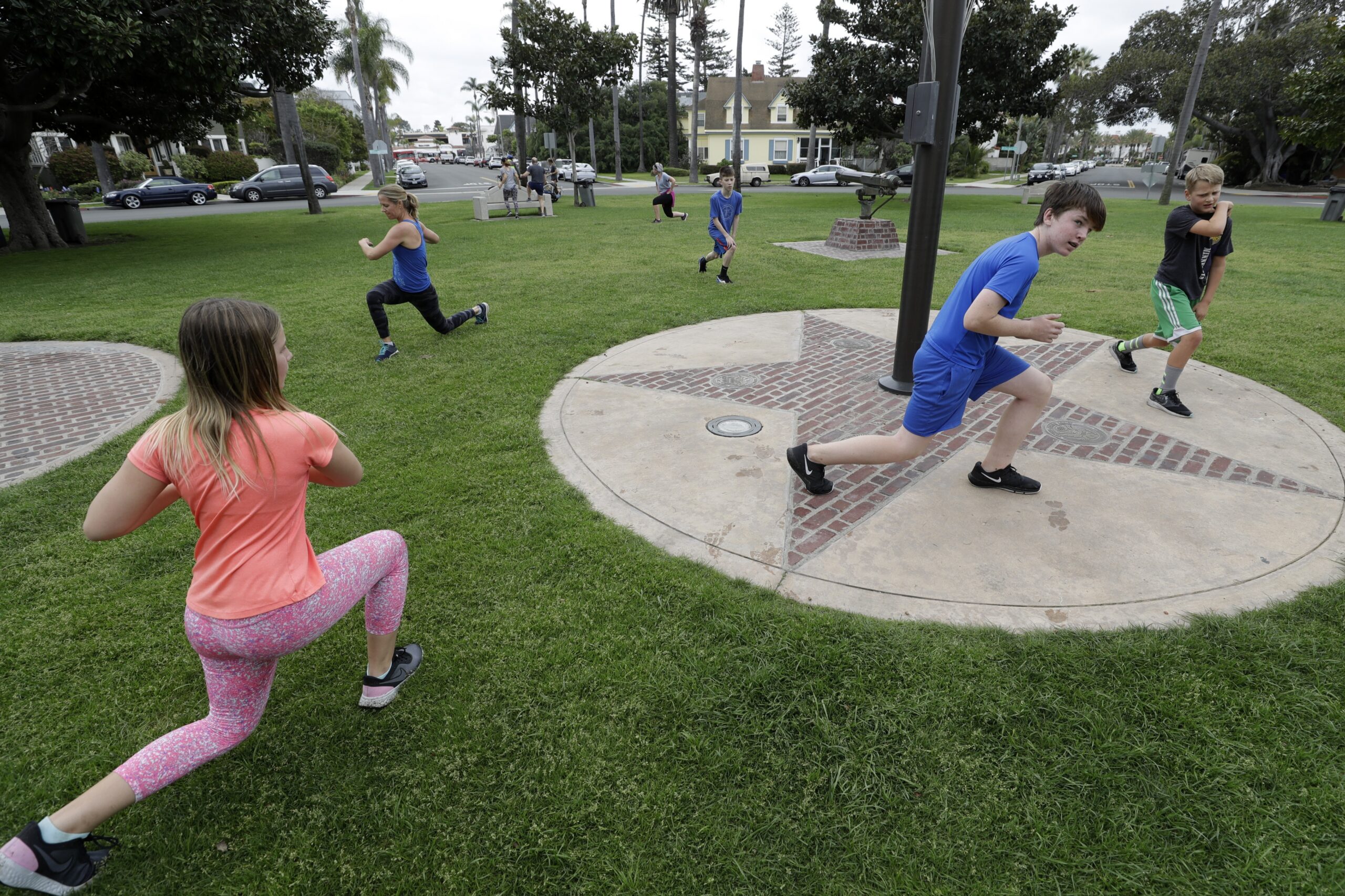 Kids exercise with their parents amid COVID-19 pandemic