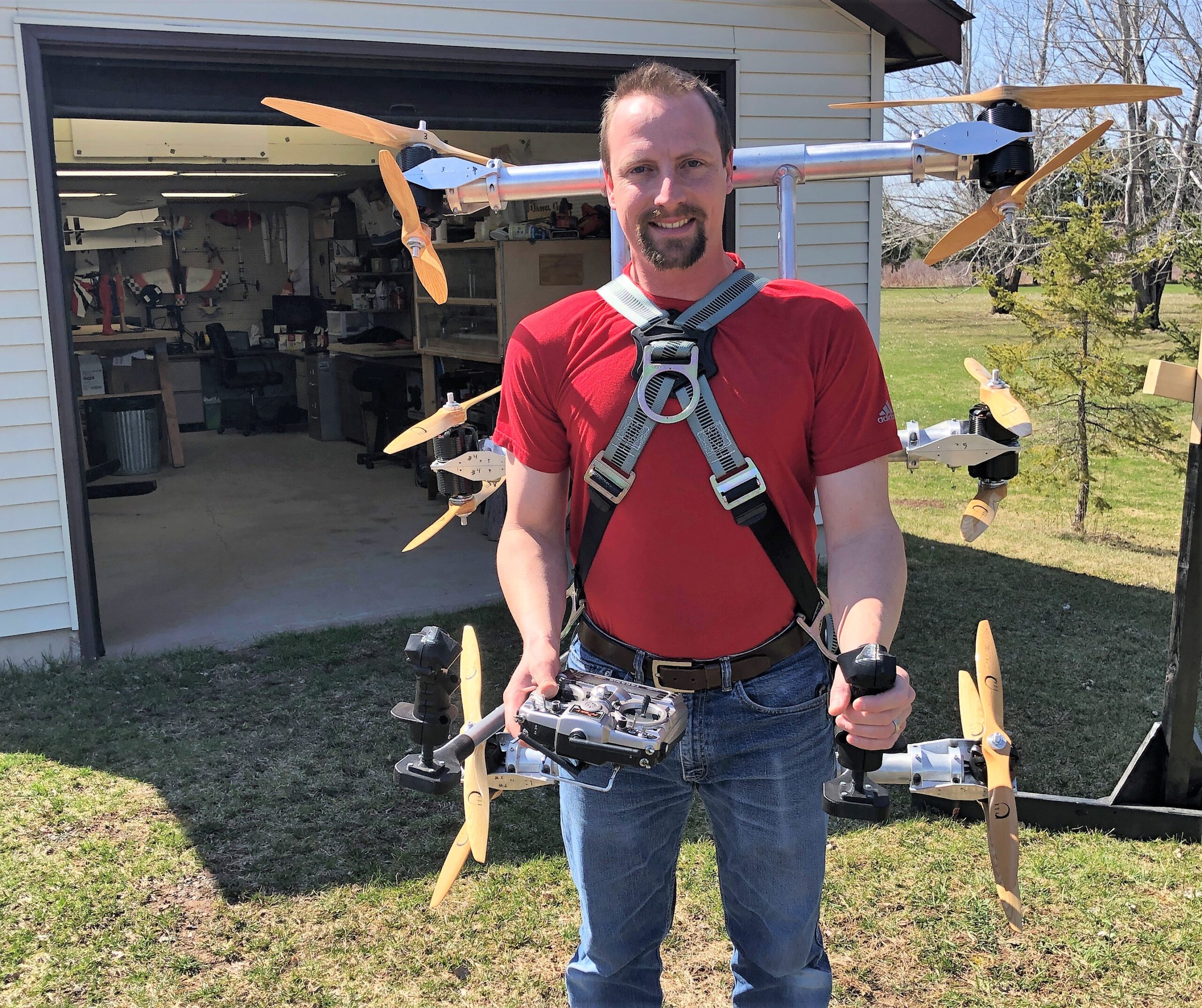 Daniel Gant tries on his human-sized drone prototype, the Skypak V1, outside his workshop in Poplar. The mechanical engineer hopes to develop a new way of individualized propeller flying that will free up a pilot's hands.