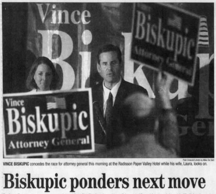 In this clipping from the Nov. 6, 2002 edition of the Appleton Post-Crescent, Vince Biskupic is seen as he concedes the race for attorney general