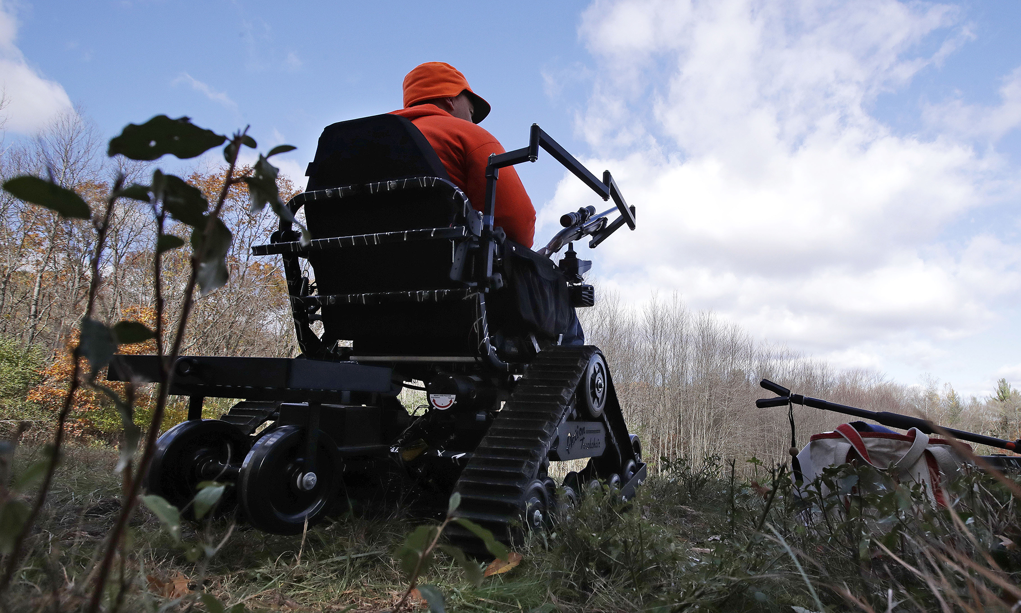paraplegic hunter Gary Dupuis waits in his all-terrain wheelchair, equipped with a shooting rack for his shotgun