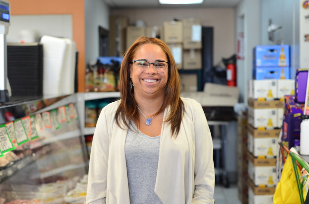 Mariam Maldonado poses in Luna's Groceries, which she owns.