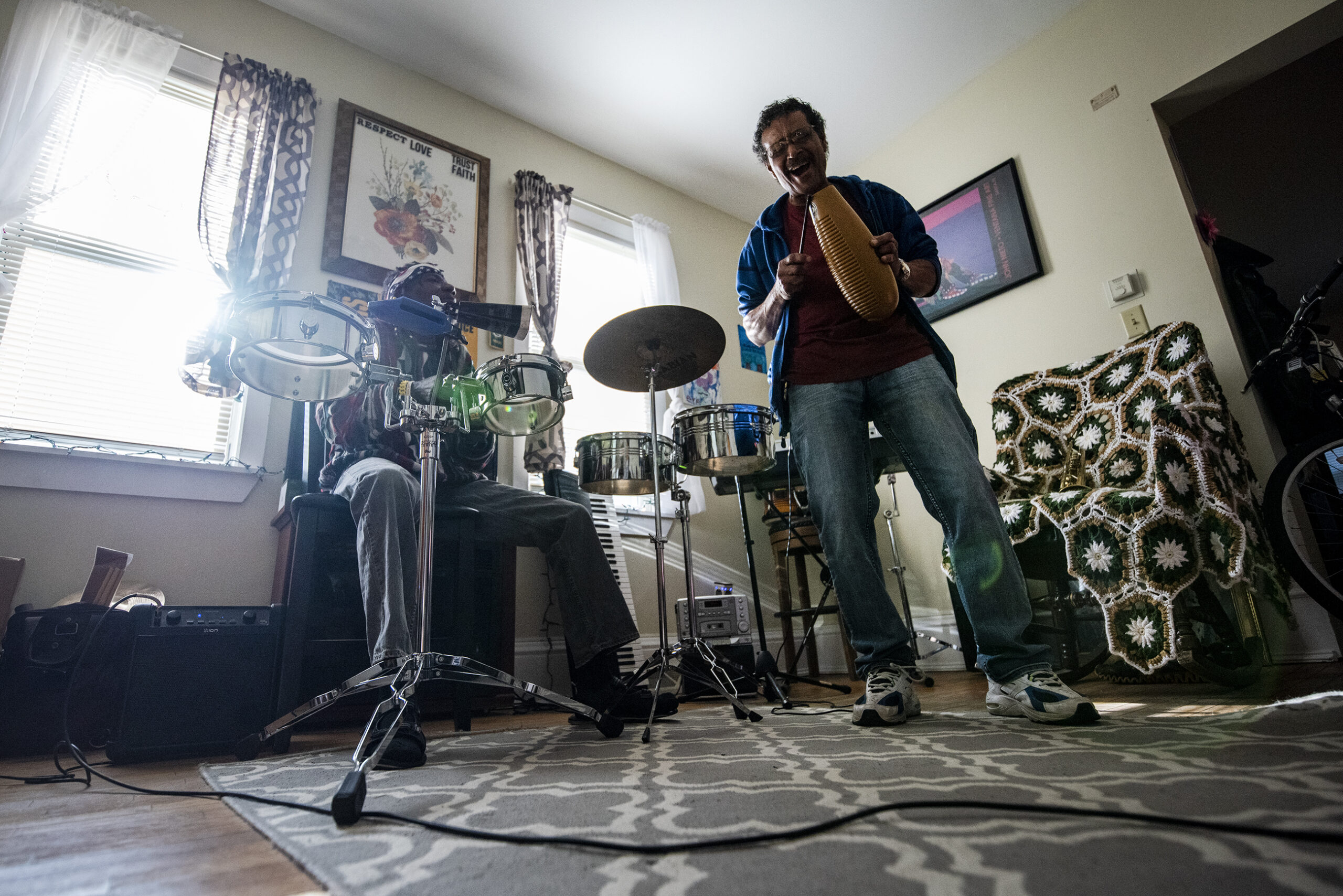 Cuban refugees play music in Pozo and Rodriguez's living room