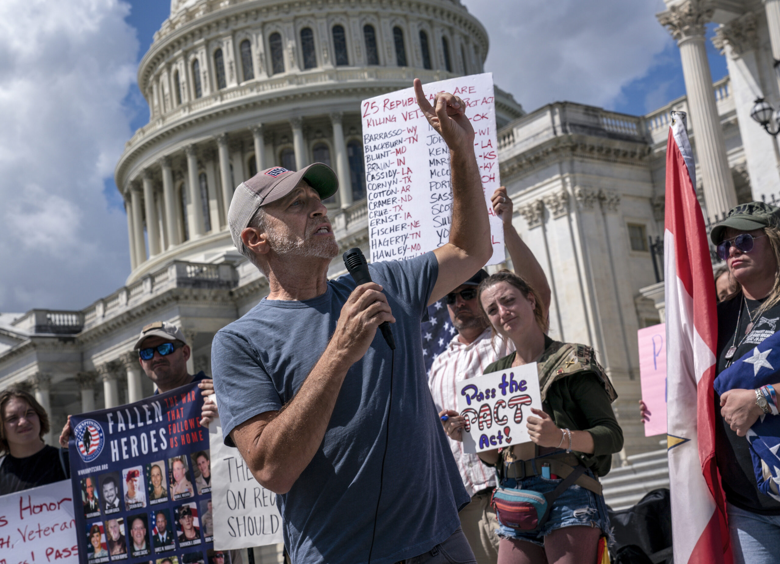 Comedian Jon Stewart speaks into a microphone outside the U.S. Capitol