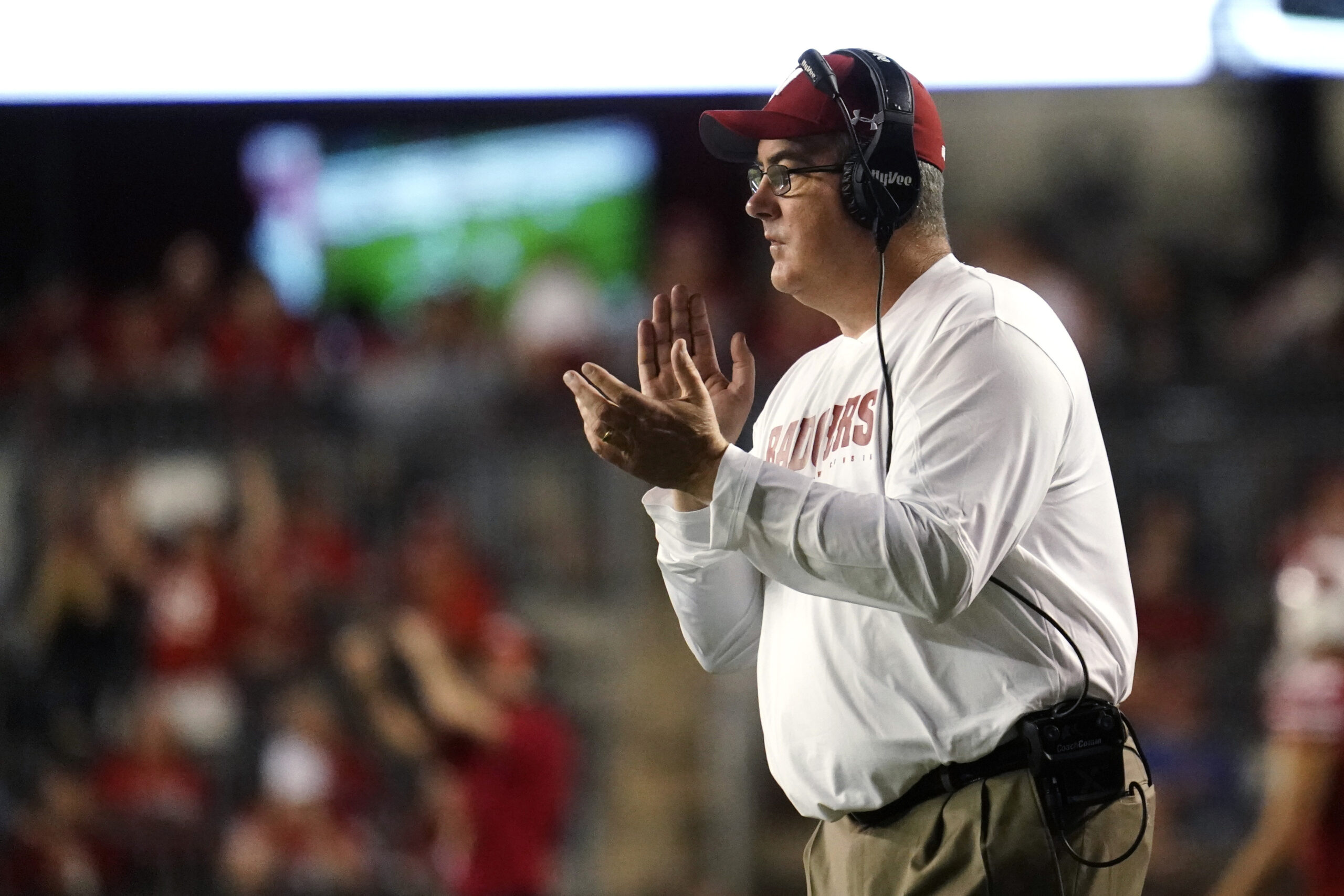 Wisconsin head coach Paul Chryst claps during the second half.