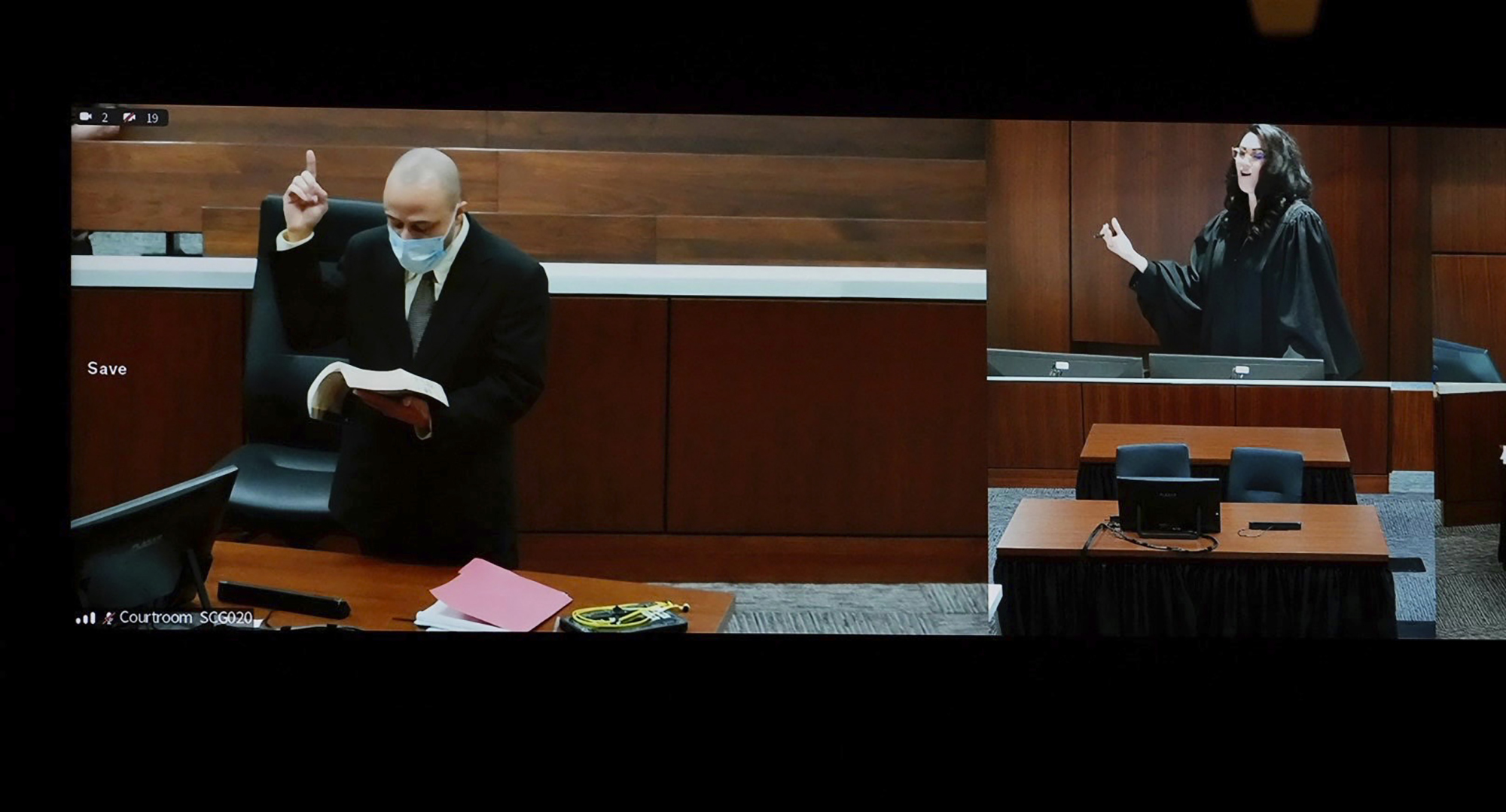 Darrell Brooks reads from the Bible during jury selection in his trial