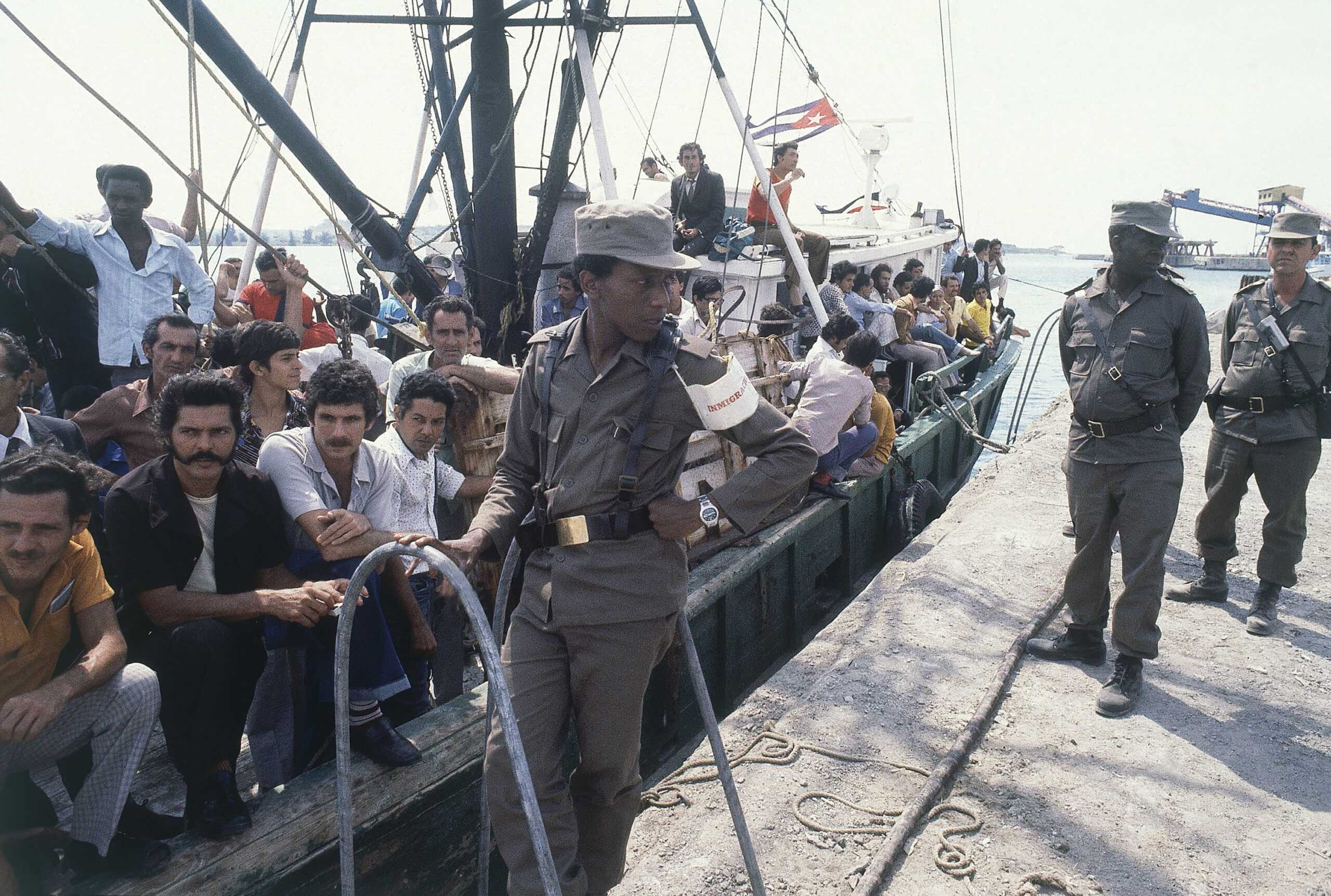 A Cuban soldier stands by a refugee ship at the small port of Mariel, Cuba, as the refugees aboard wait to sail for U.S.