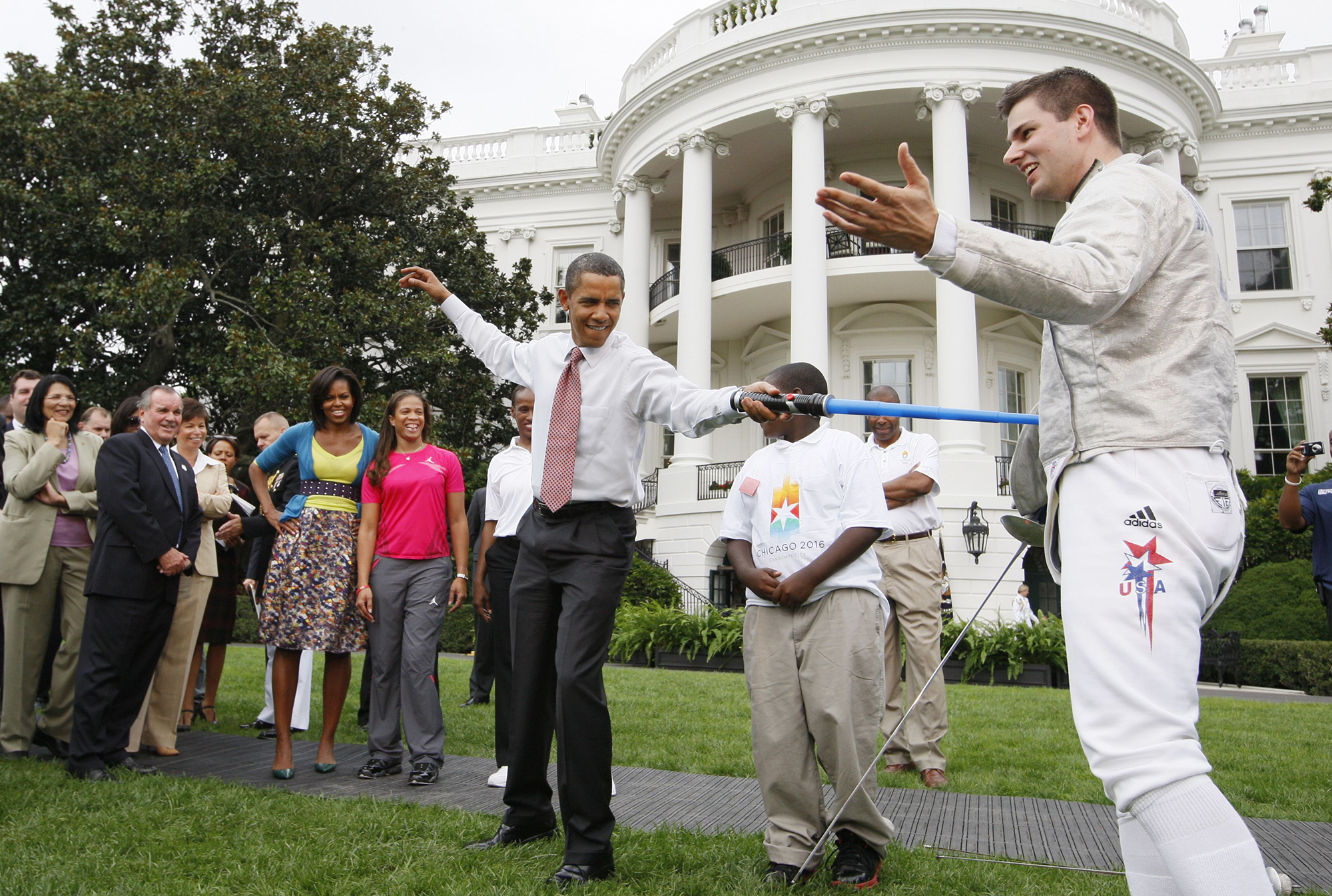 President Barack Obama uses a light saber