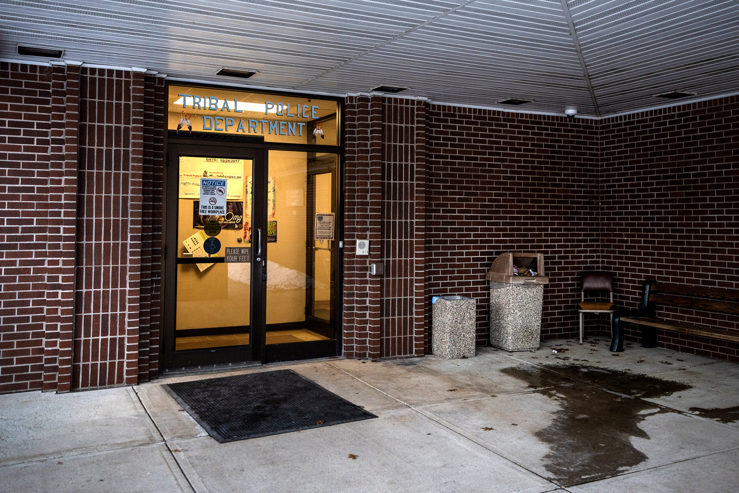 Yellow light can be seen through glass doors.