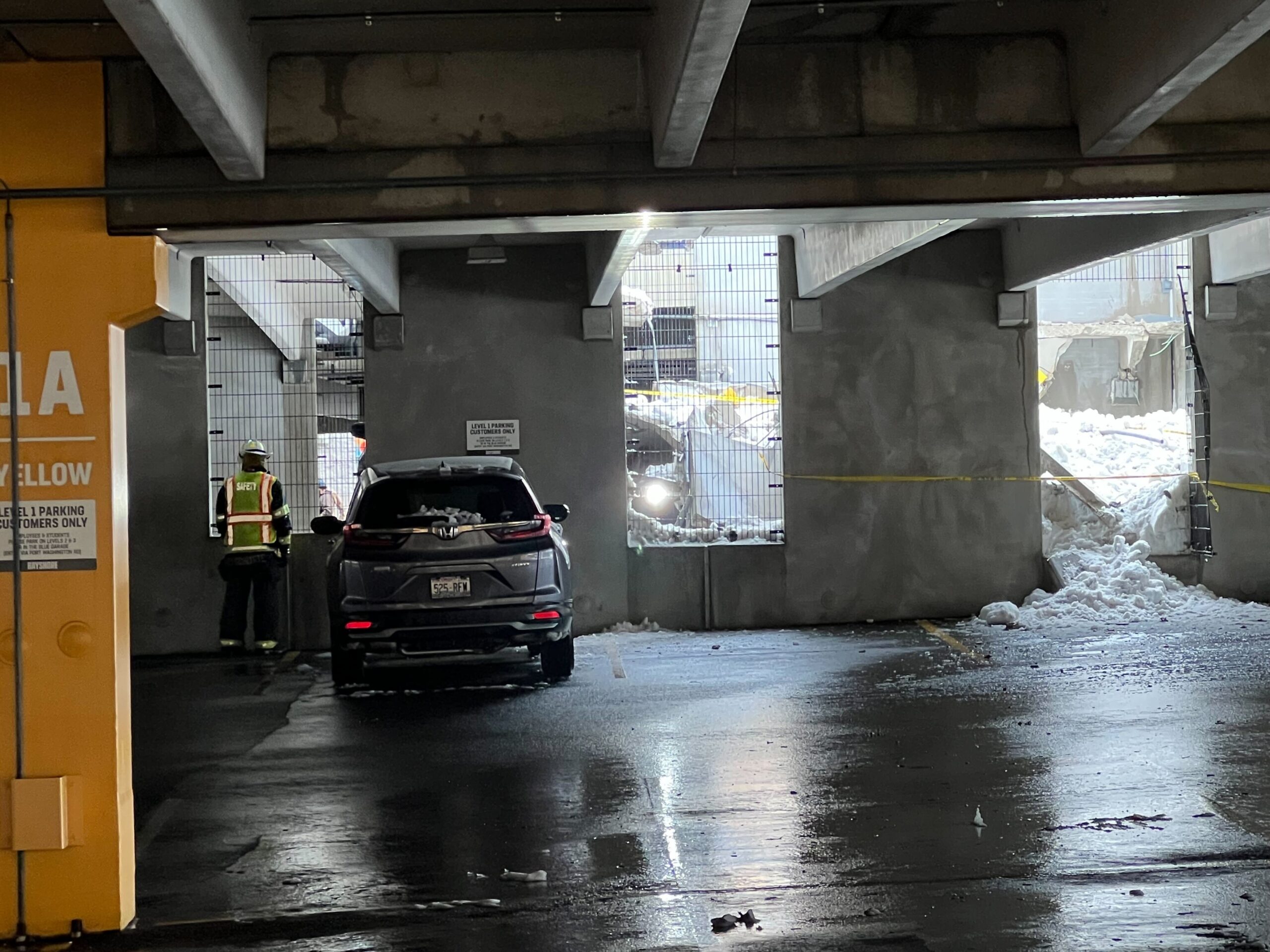 Three floors of the parking garage collapsed early Thursday, Feb. 23, 2023, at Bayshore Mall in Glendale.