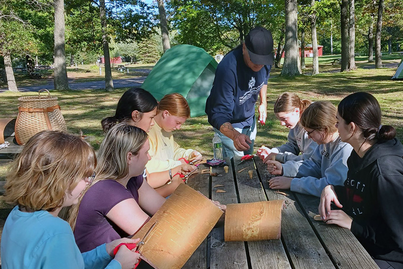 Students participate in a craft workshop with Lac du Flambeau artist Greg Johnson