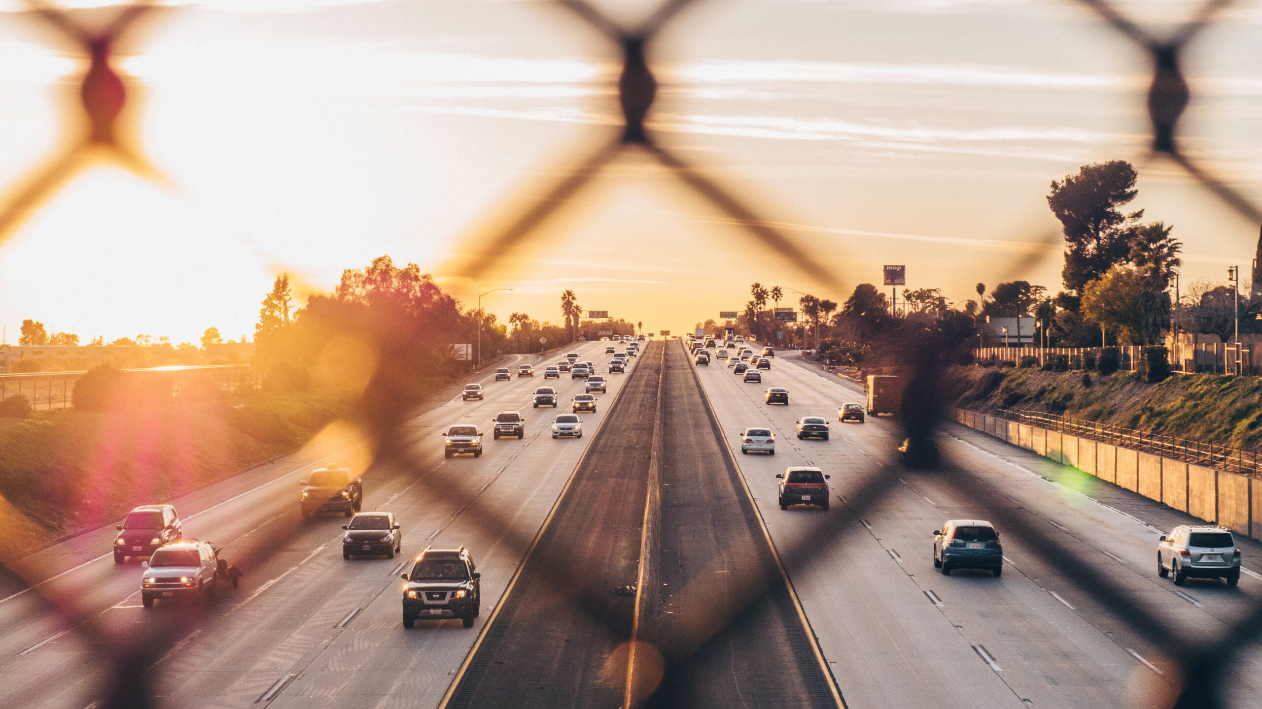 Highway traffic seen from overpass.