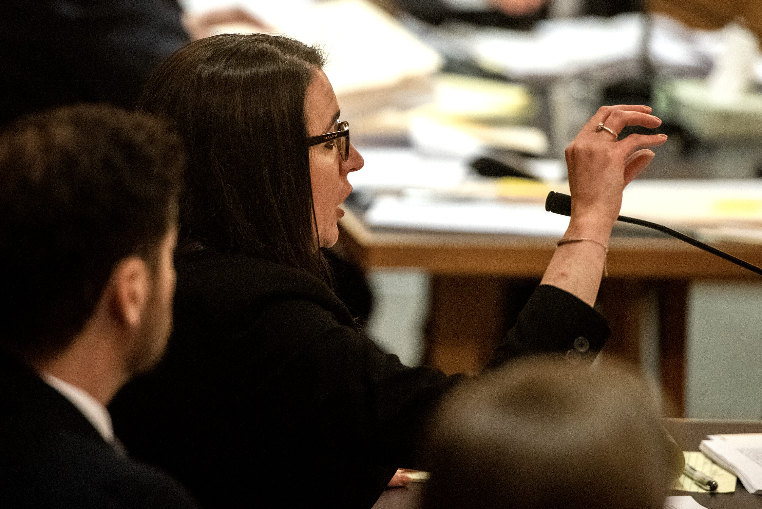 An attorney gestures as she speaks looking at the judge.