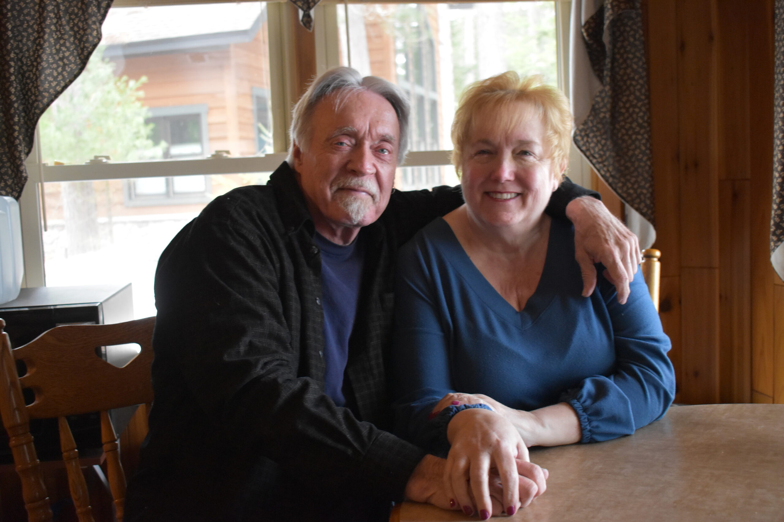 Jim and Colleen Rooney sit at their kitchen table