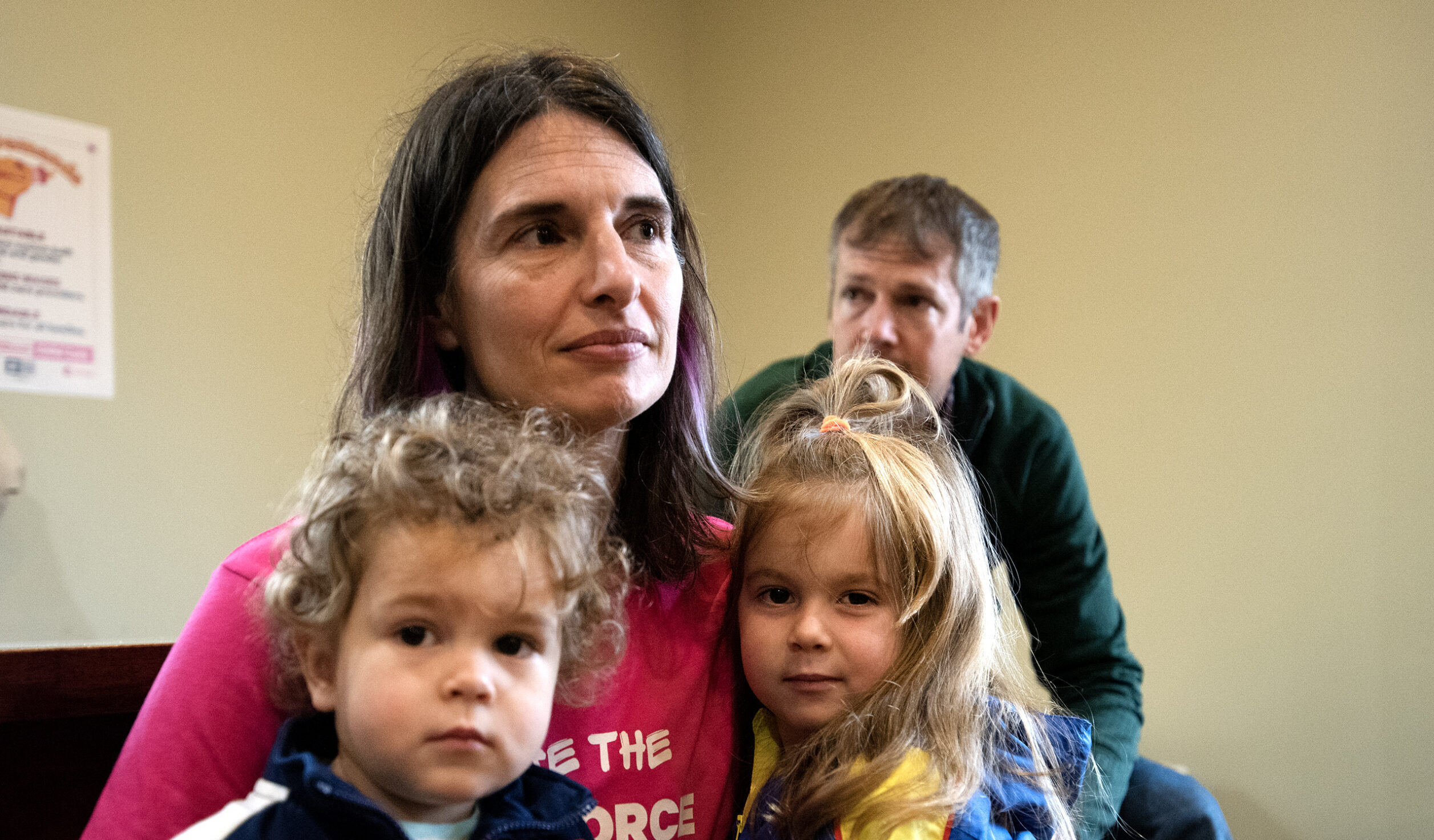 Corrine Hendrickson sits near two children.