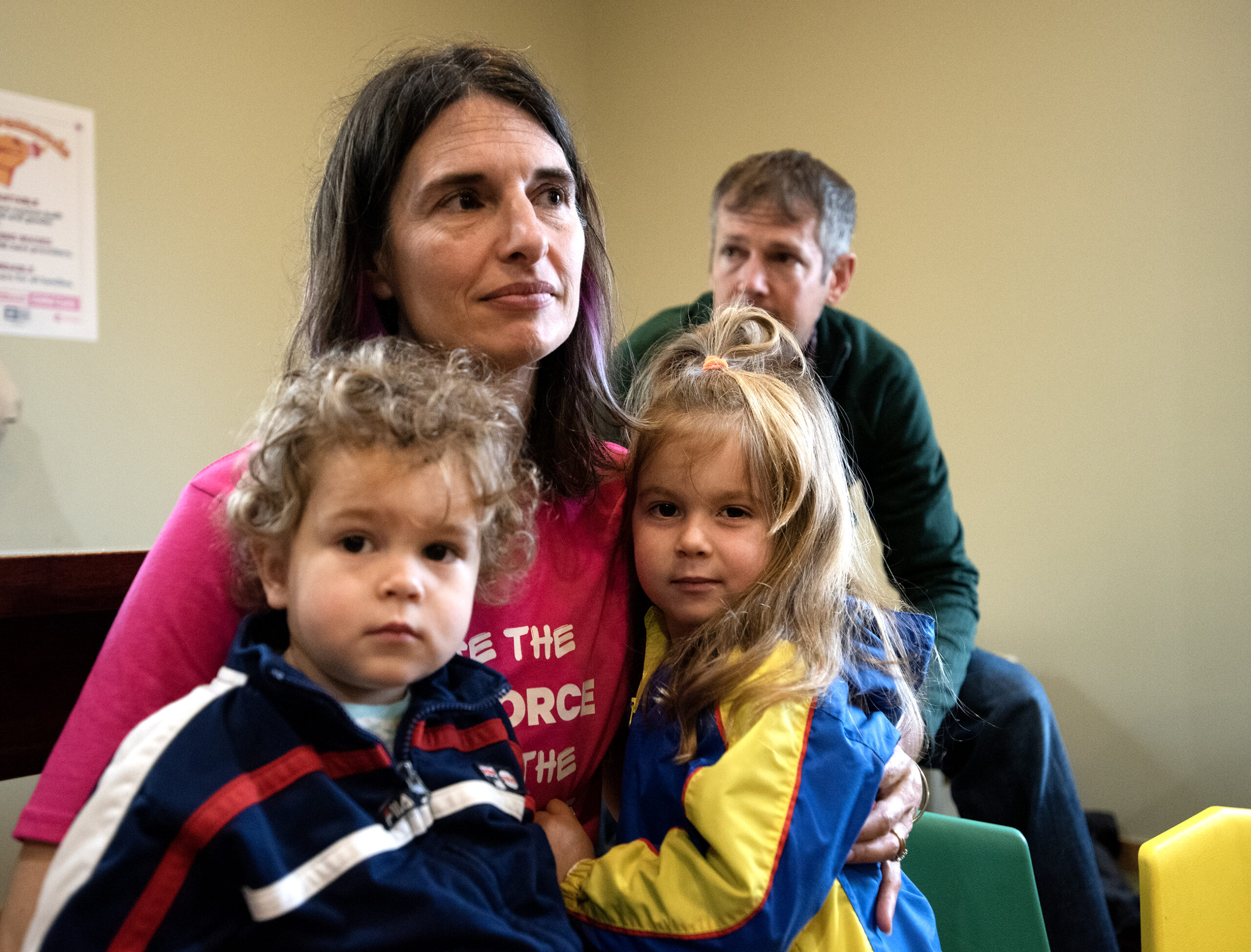 Corrine Hendrickson sits near two children.