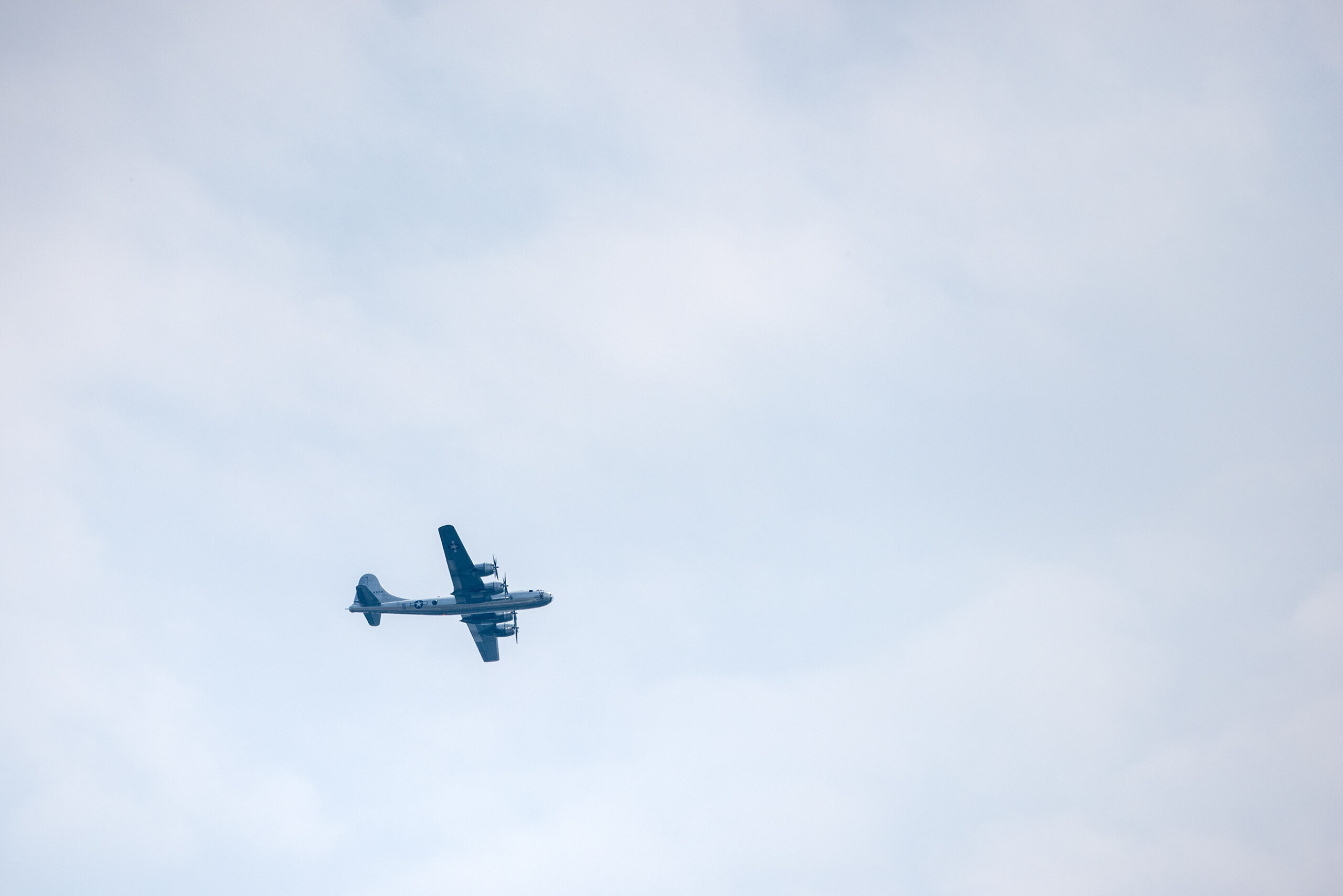 A large military airplane flies in the air.