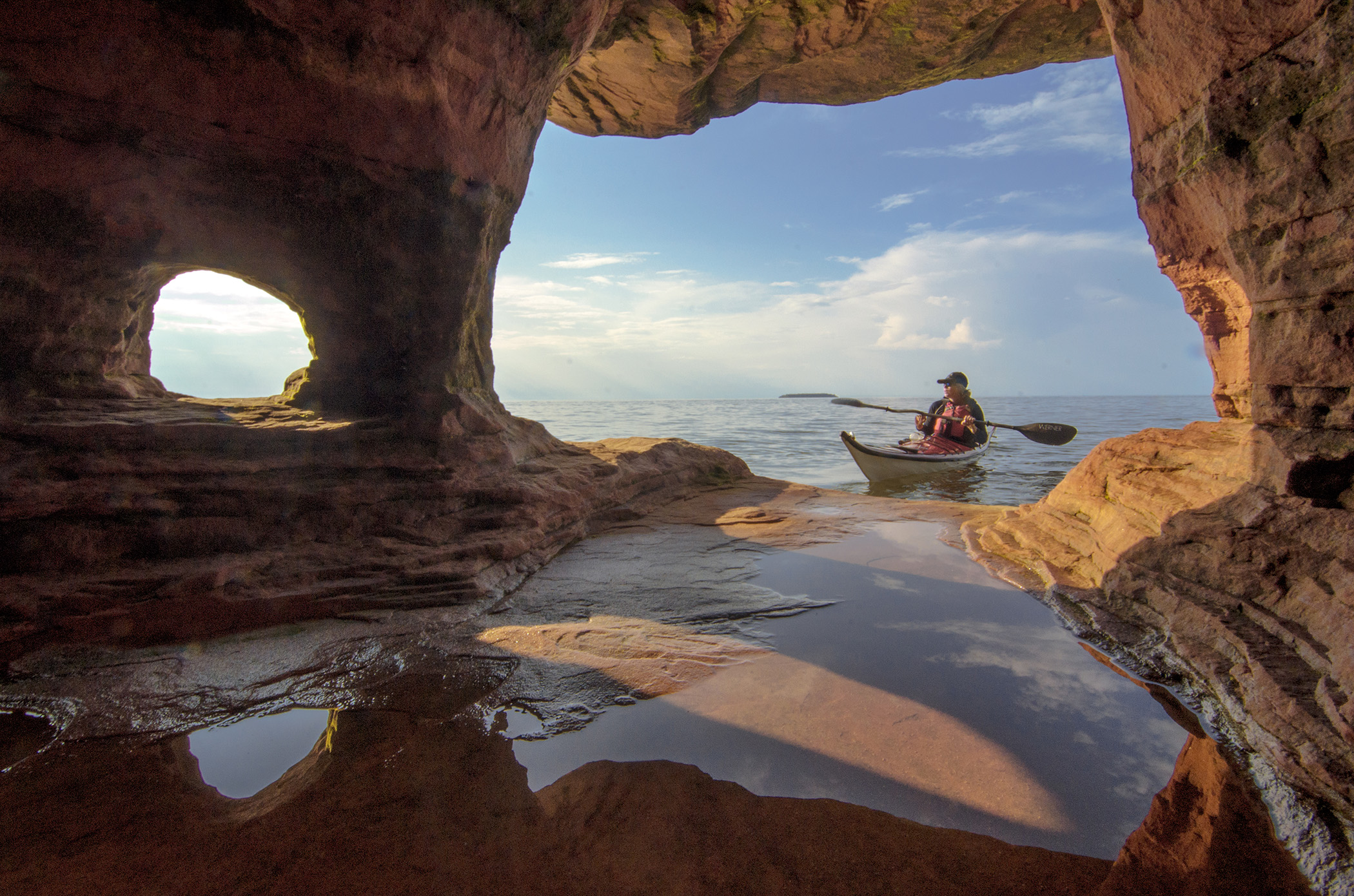Kayaker explores the Apostle Islands sea caves